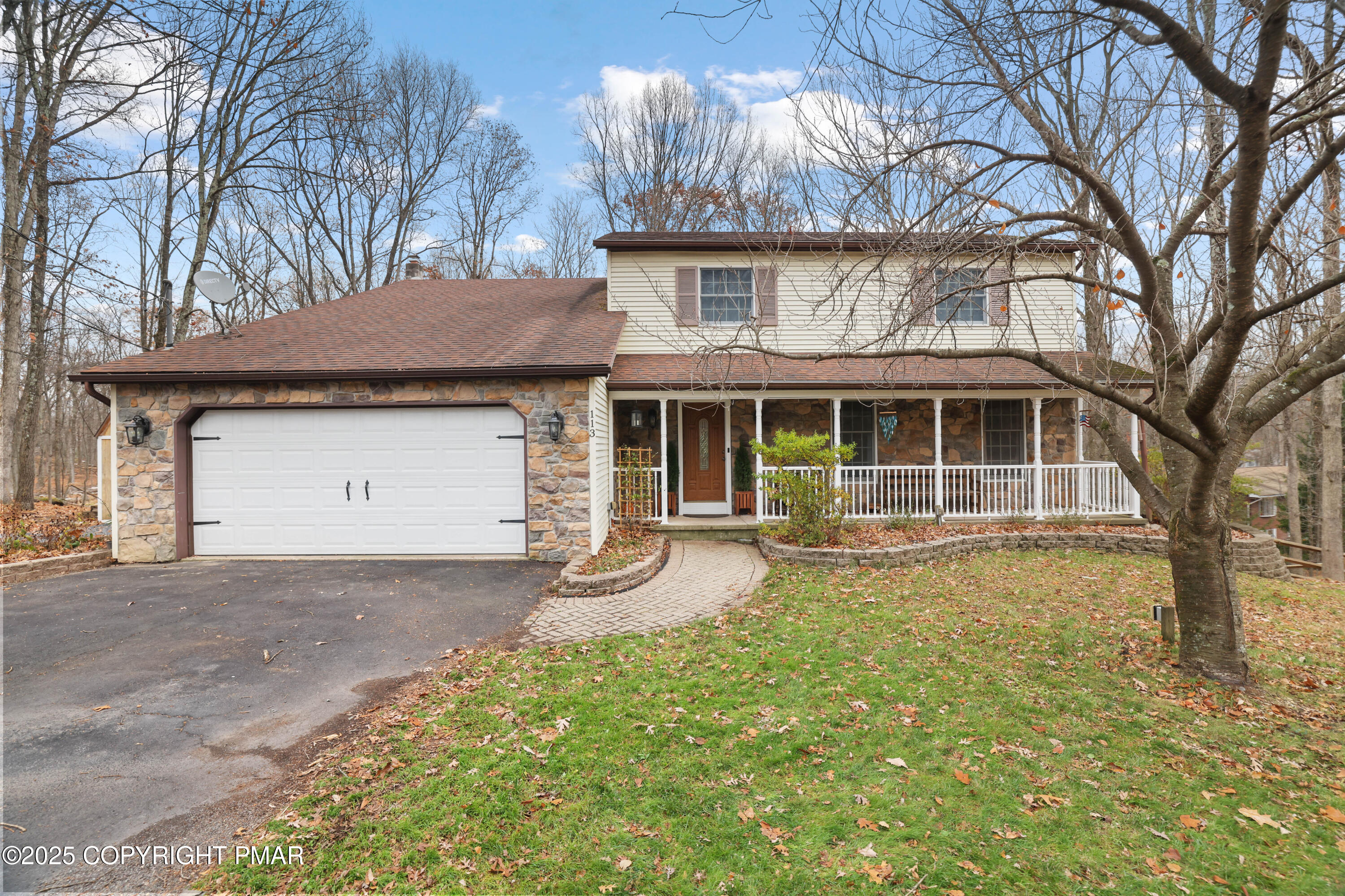 113 Hemlock Road Tannersville, PA 18372 - Photo 2 of 68 a front view of a house with a garden and trees