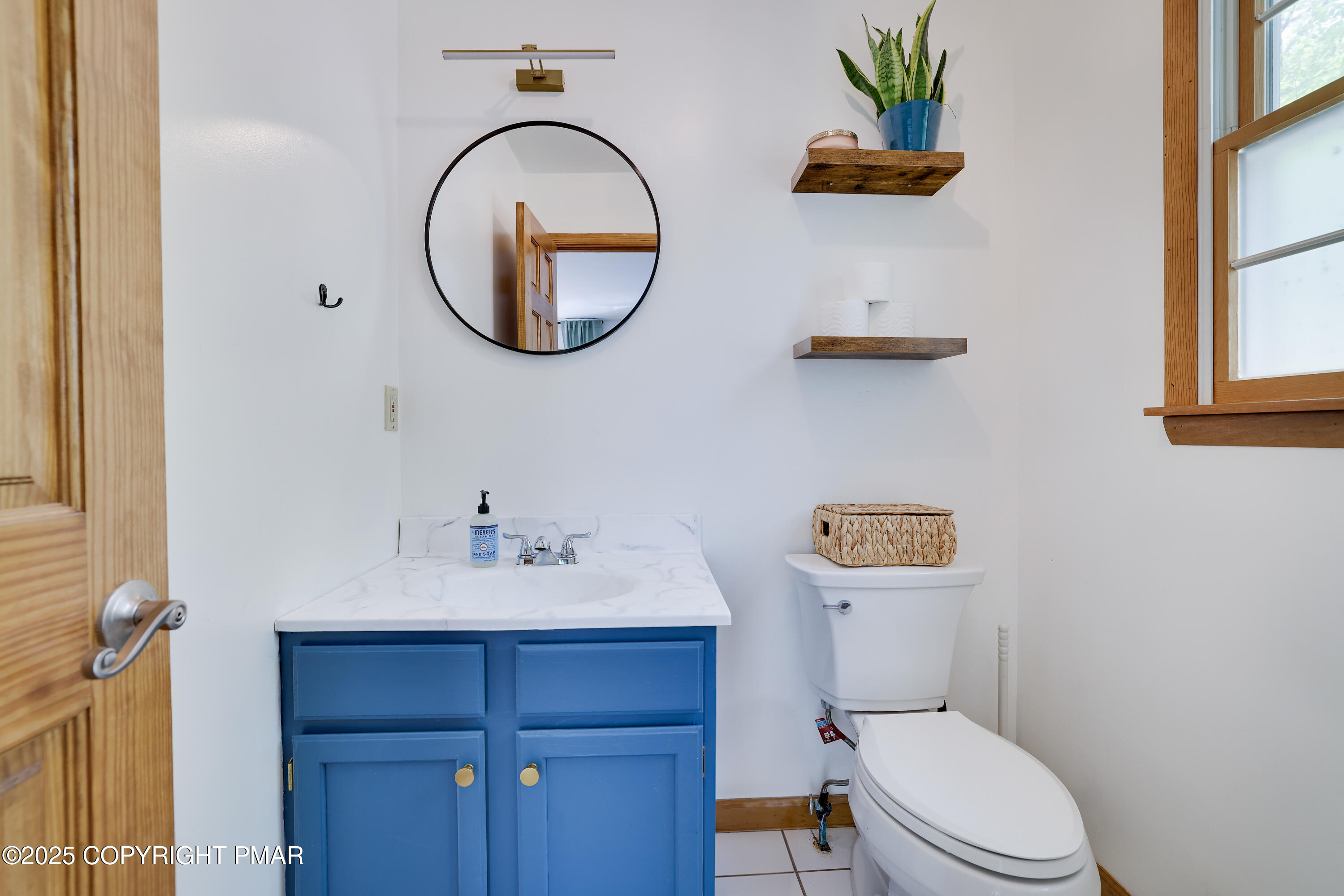 113 Hemlock Road Tannersville, PA 18372 - Photo 23 of 68 a bathroom with a toilet a sink and a mirror