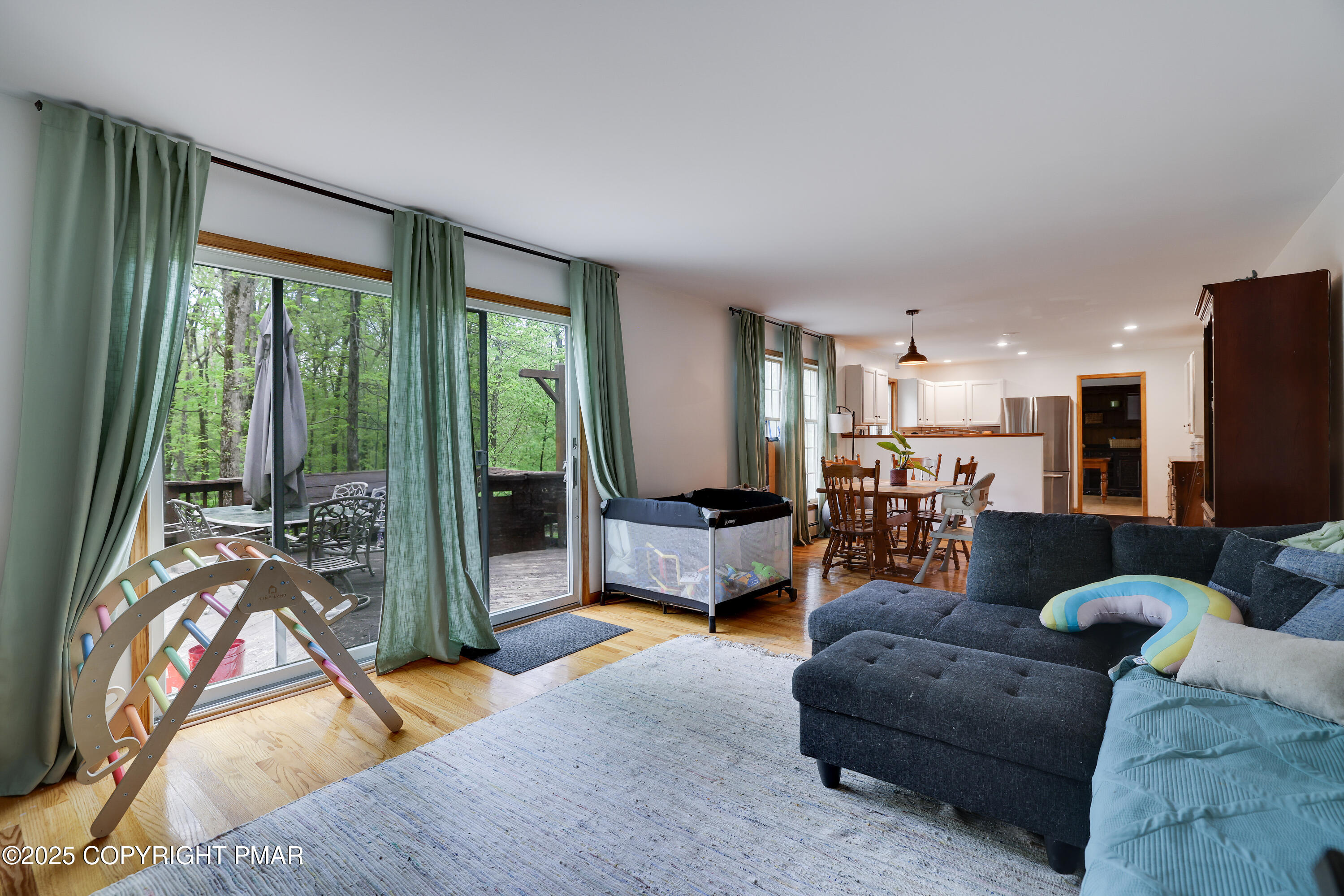 113 Hemlock Road Tannersville, PA 18372 - Photo 25 of 68 a living room with furniture and a large window