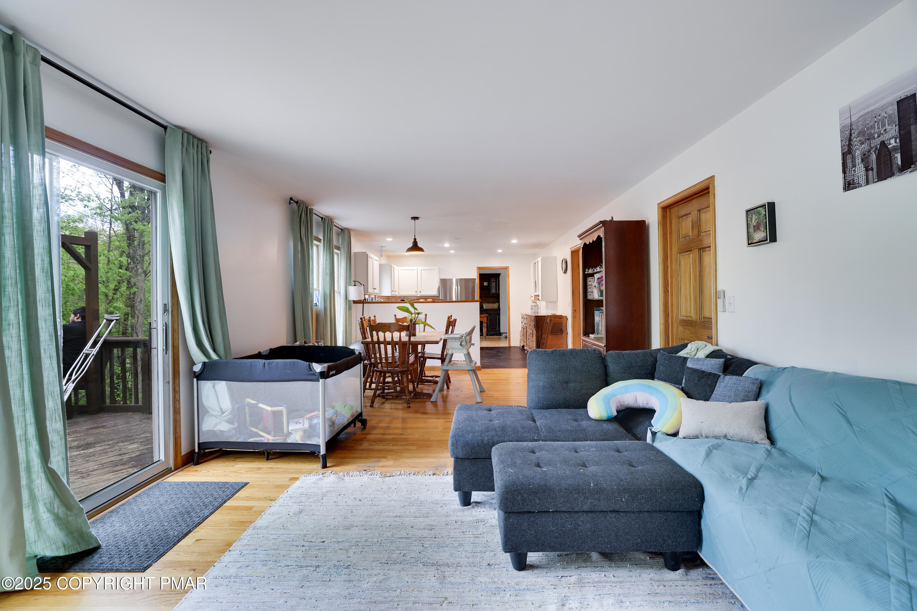 113 Hemlock Road Tannersville, PA 18372 - Photo 26 of 68 a living room with furniture and a large window