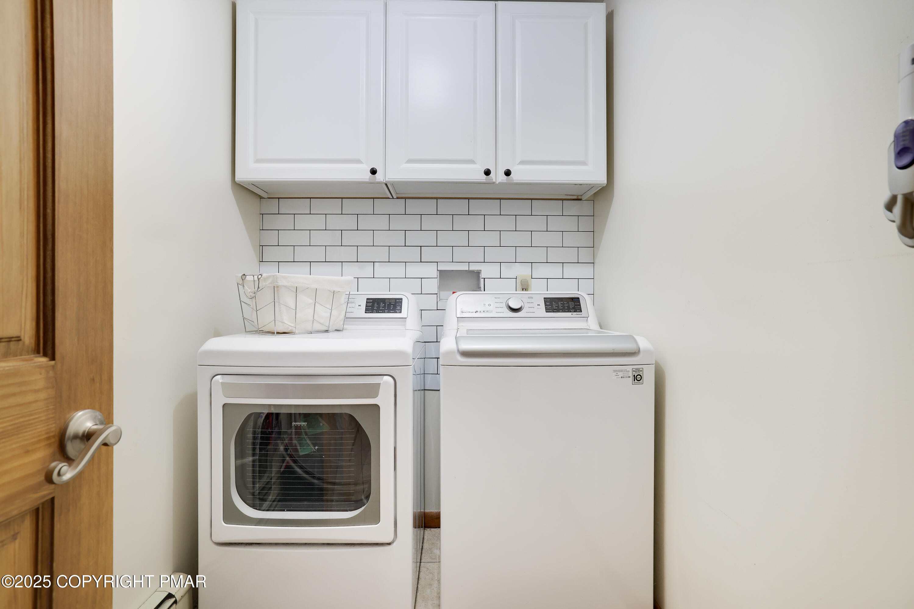 113 Hemlock Road Tannersville, PA 18372 - Photo 27 of 68 a view of washer and dryer with kitchen in the background