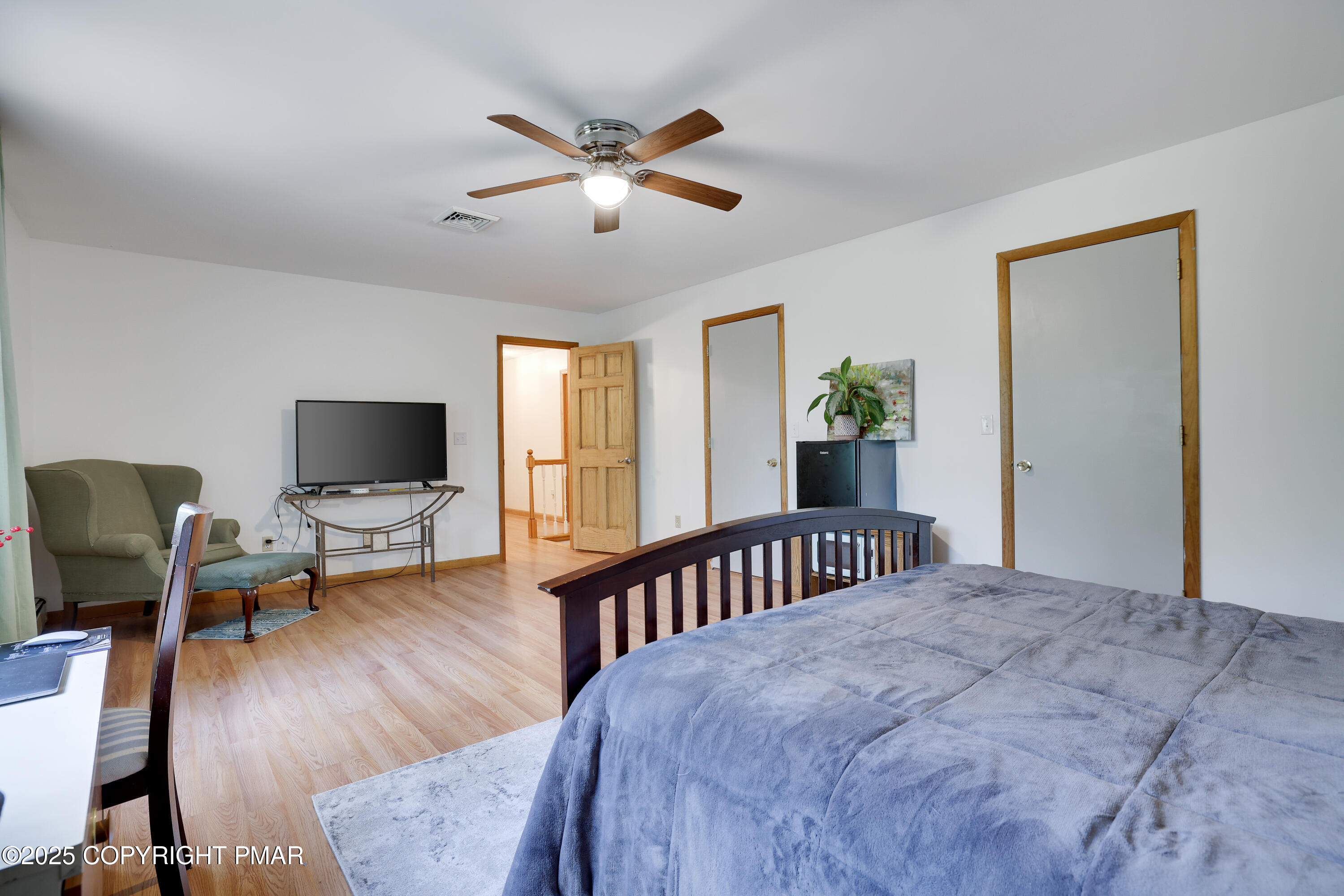113 Hemlock Road Tannersville, PA 18372 - Photo 30 of 68 a bedroom with a bed and wooden floor