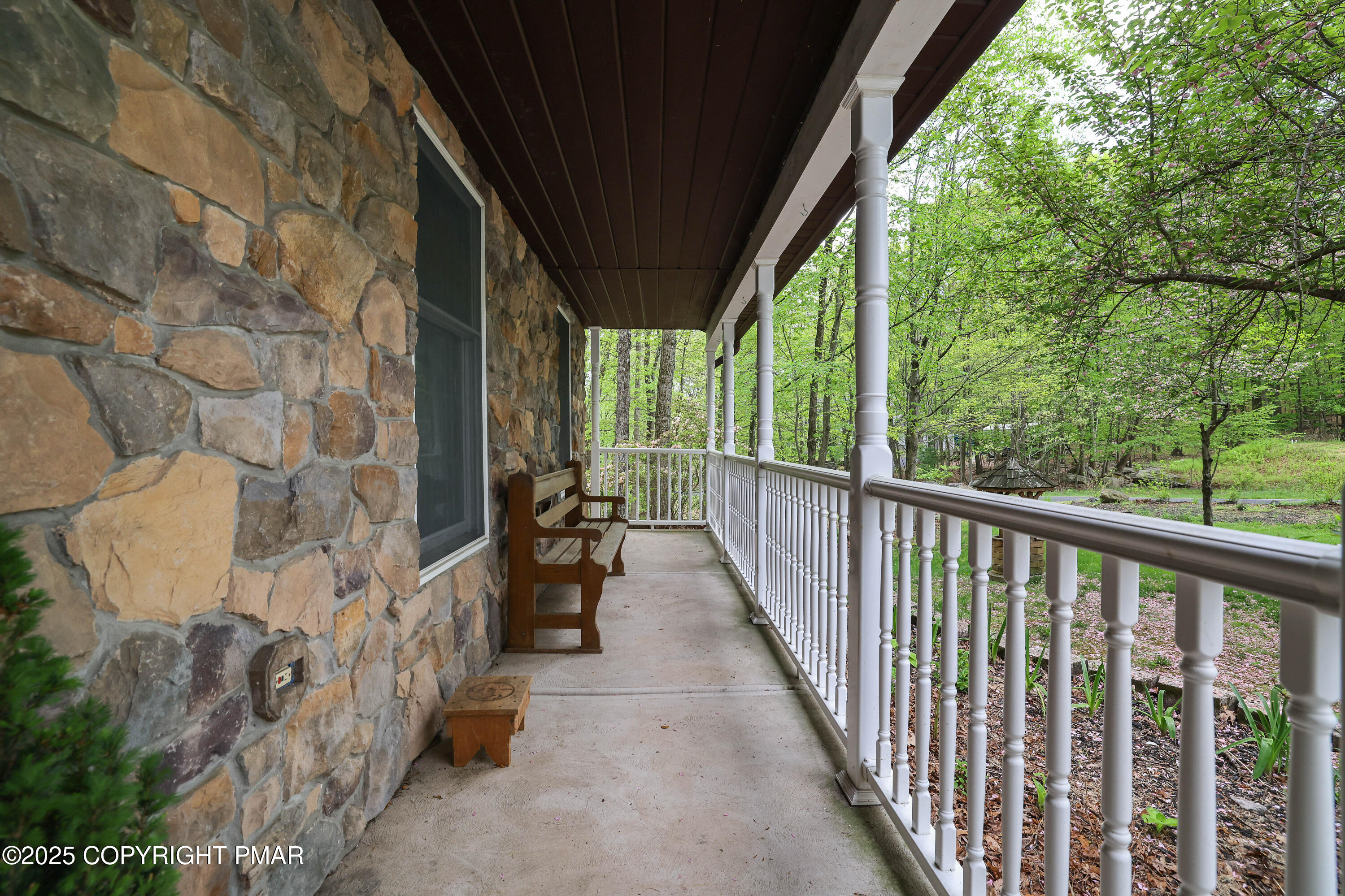 113 Hemlock Road Tannersville, PA 18372 - Photo 3 of 68 a view of a porch with wooden floor and outdoor space