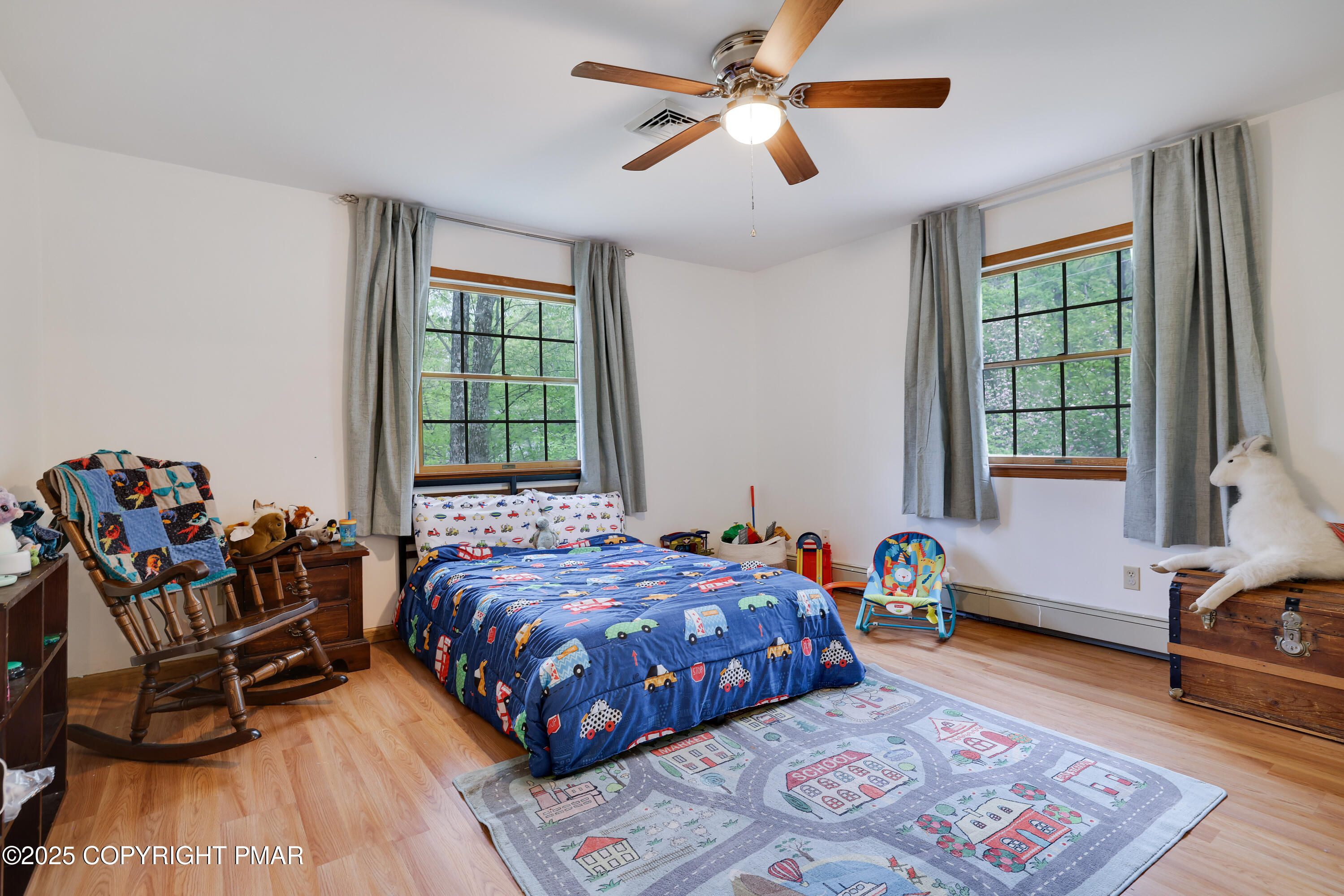 113 Hemlock Road Tannersville, PA 18372 - Photo 35 of 68 a bedroom with a bed and wooden floor