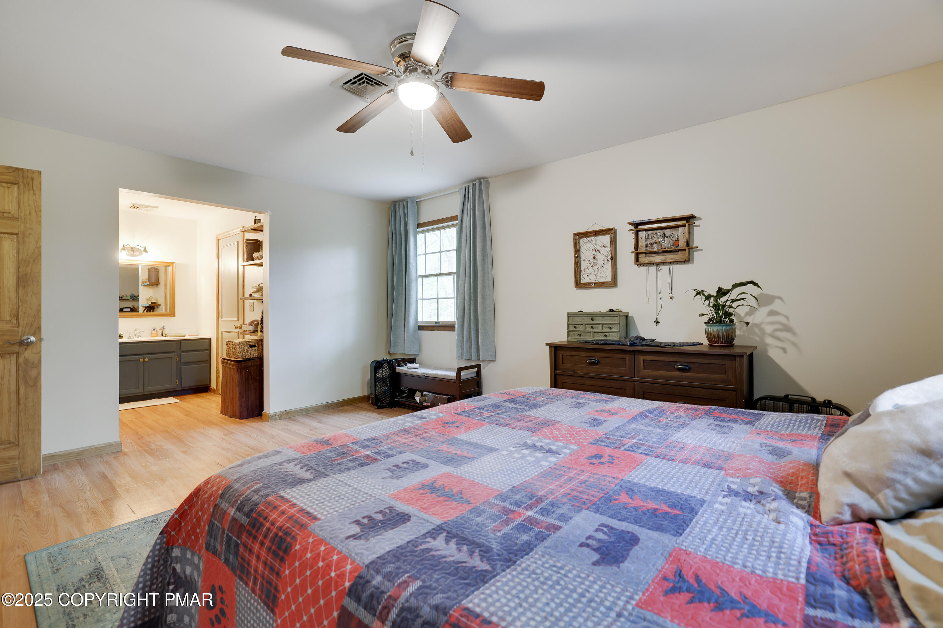 113 Hemlock Road Tannersville, PA 18372 - Photo 37 of 68 a spacious bedroom with a large bed and a chandelier
