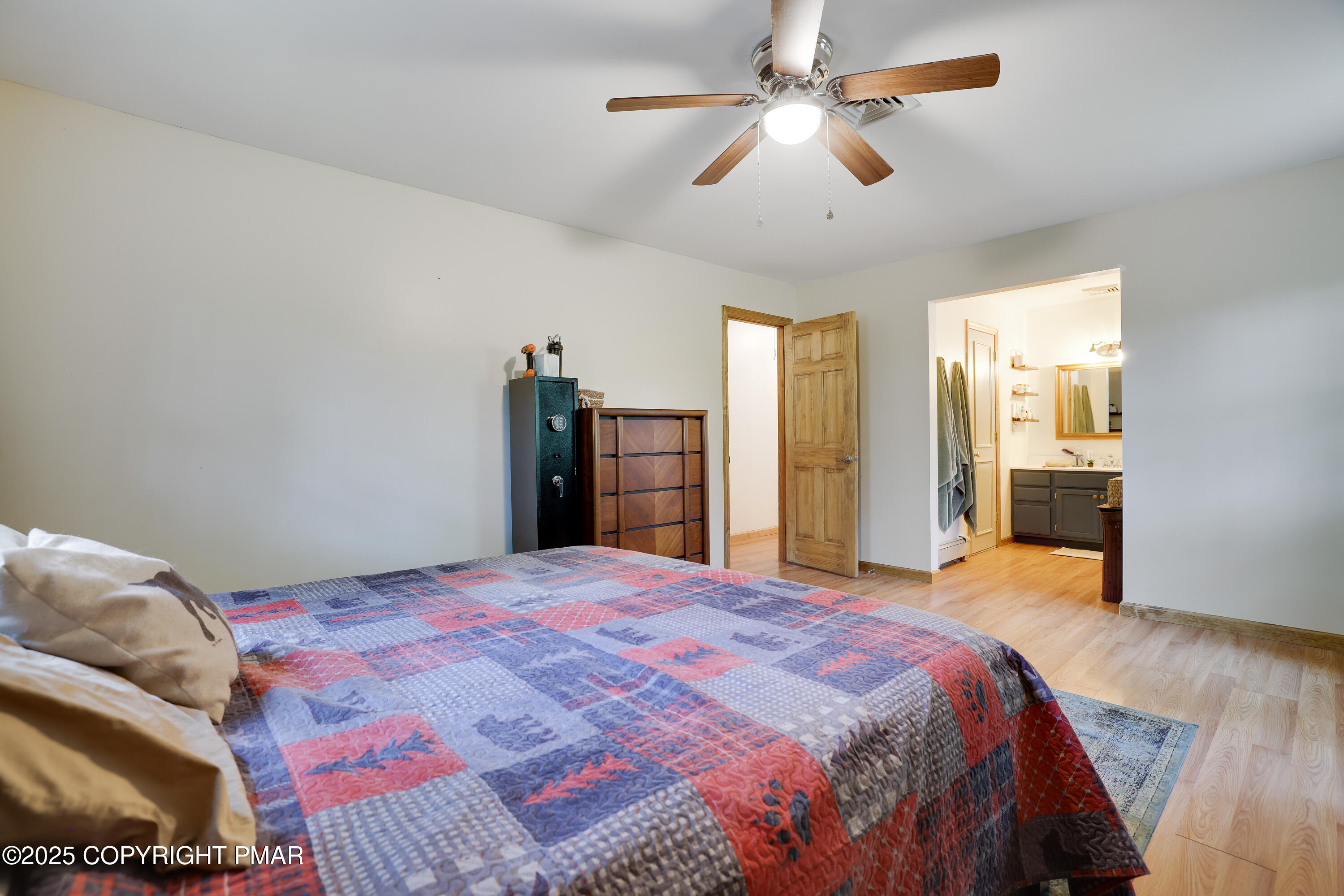 113 Hemlock Road Tannersville, PA 18372 - Photo 38 of 68 a spacious bedroom with a bed and a chandelier