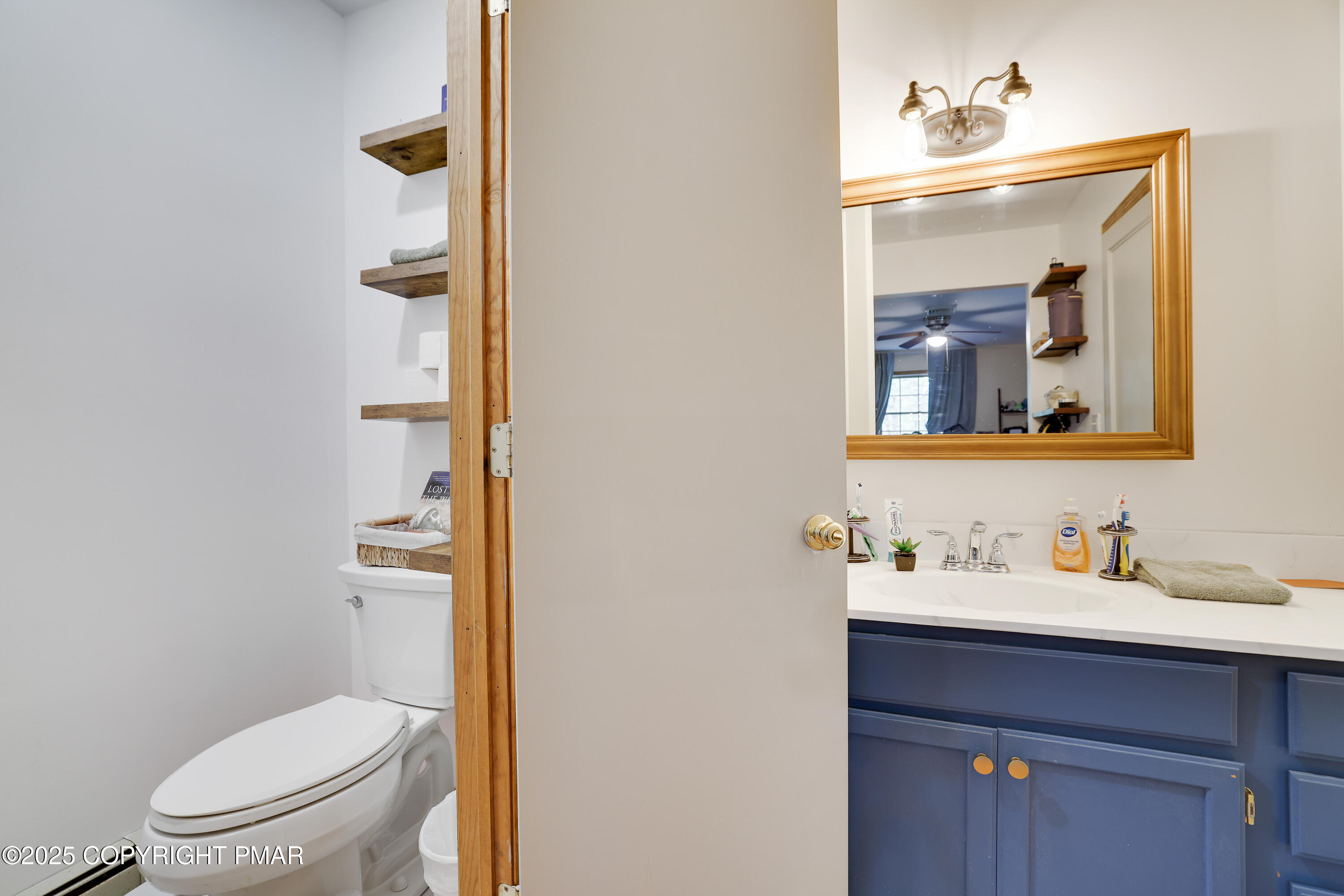 113 Hemlock Road Tannersville, PA 18372 - Photo 41 of 68 a bathroom with a toilet sink and mirror