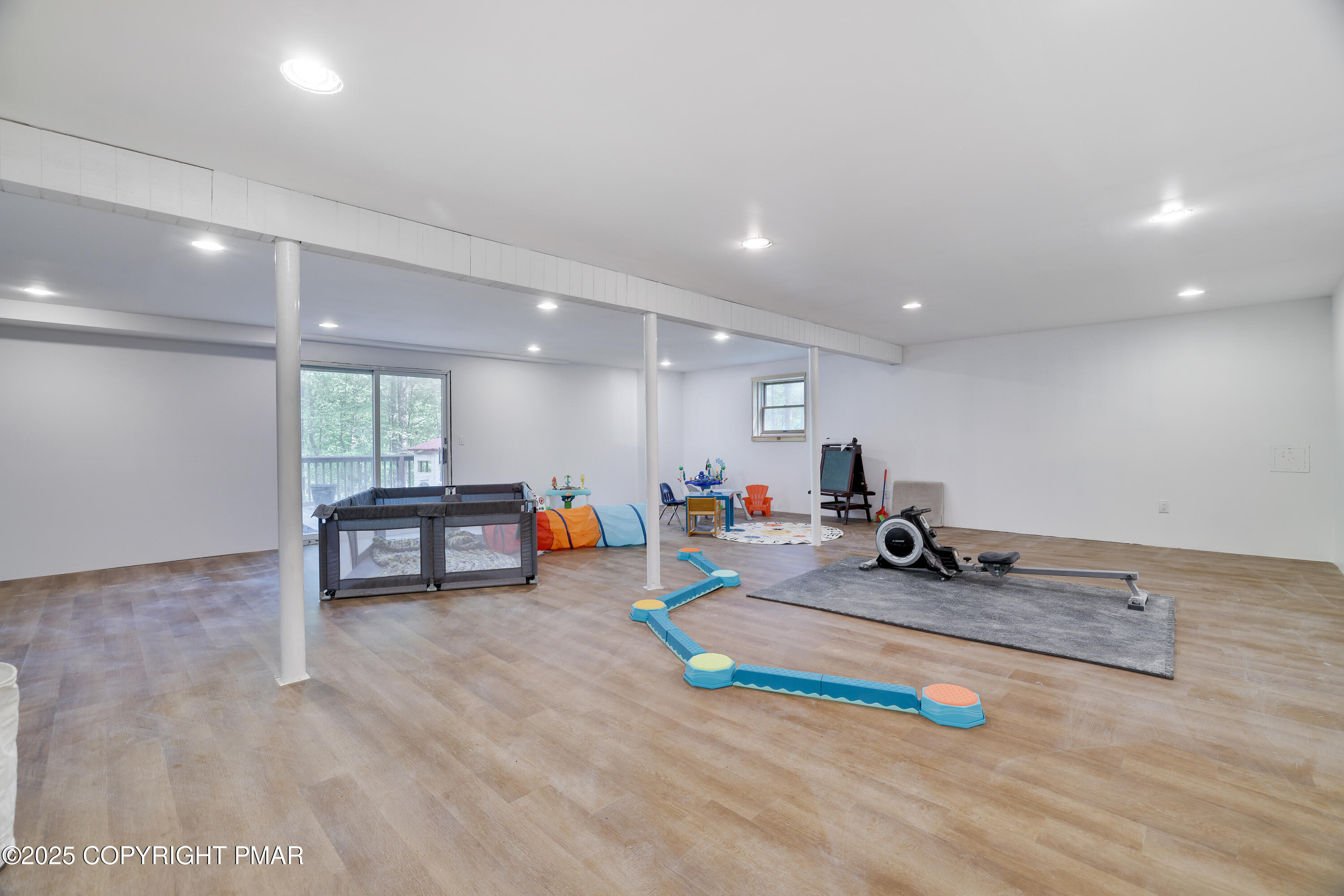 113 Hemlock Road Tannersville, PA 18372 - Photo 44 of 68 a view of a room with furniture and wooden floor