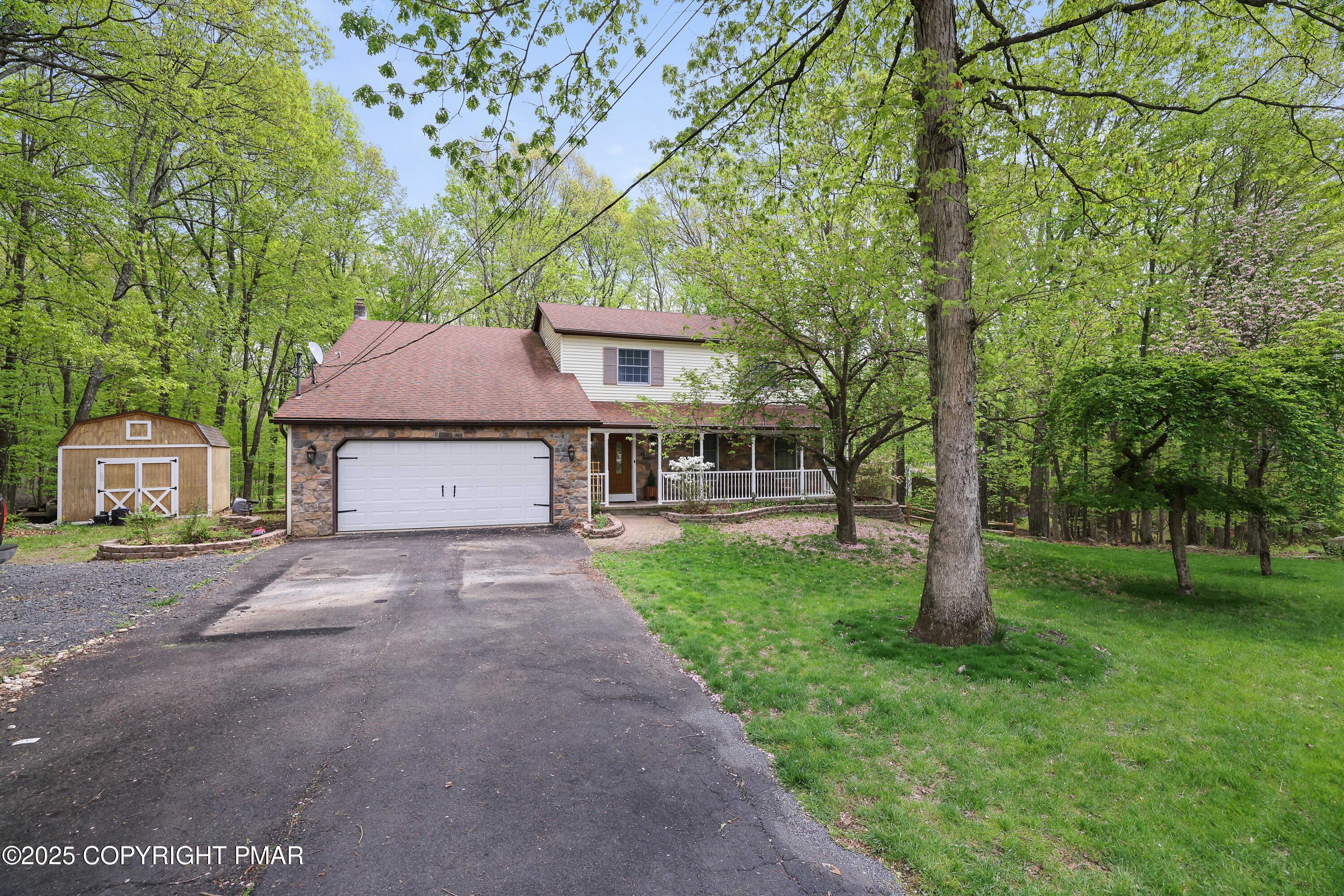 113 Hemlock Road Tannersville, PA 18372 - Photo 66 of 68 a view of a yard in front of a house with large tree