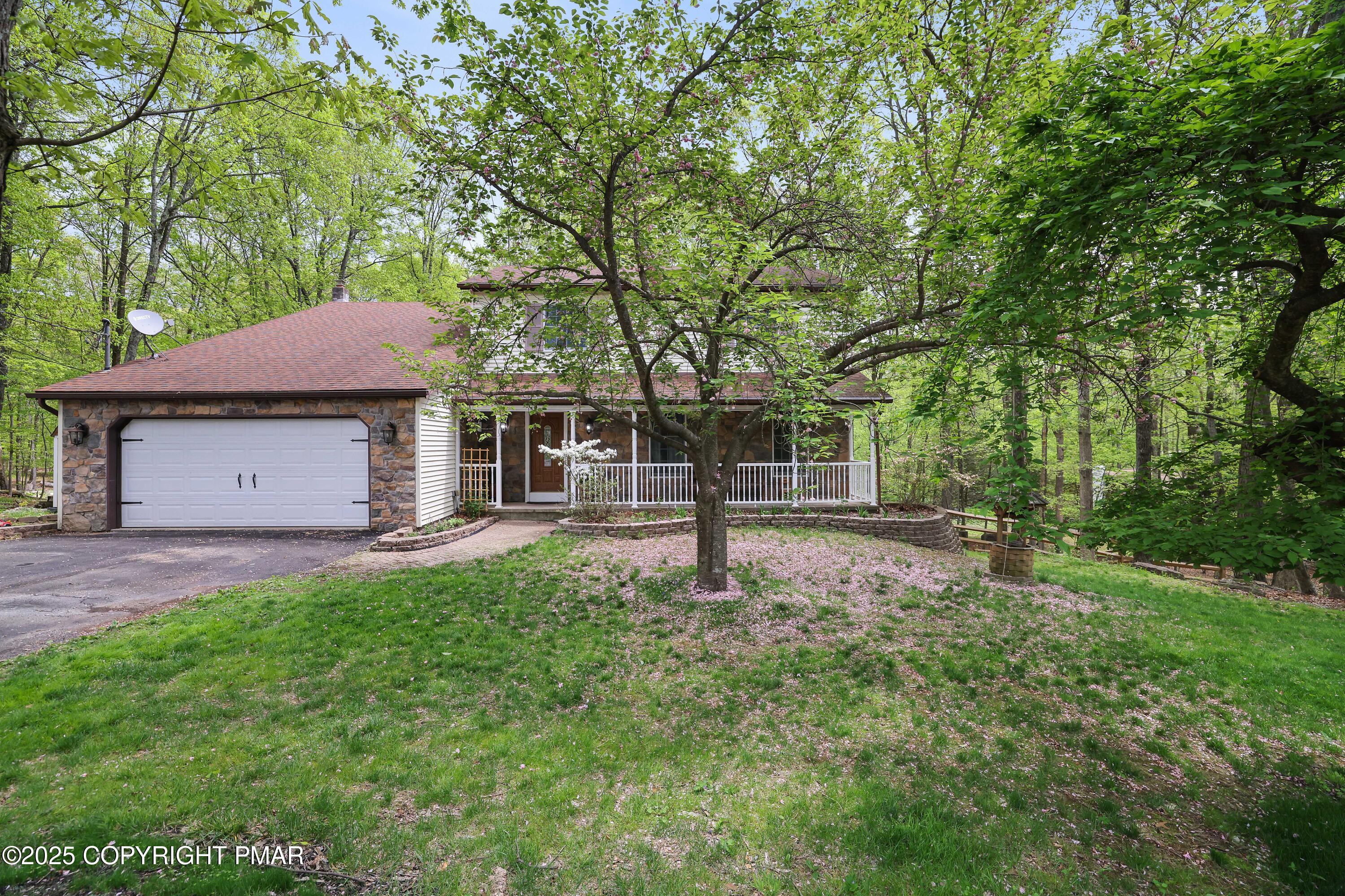 113 Hemlock Road Tannersville, PA 18372 - Photo 67 of 68 a house with trees in the background