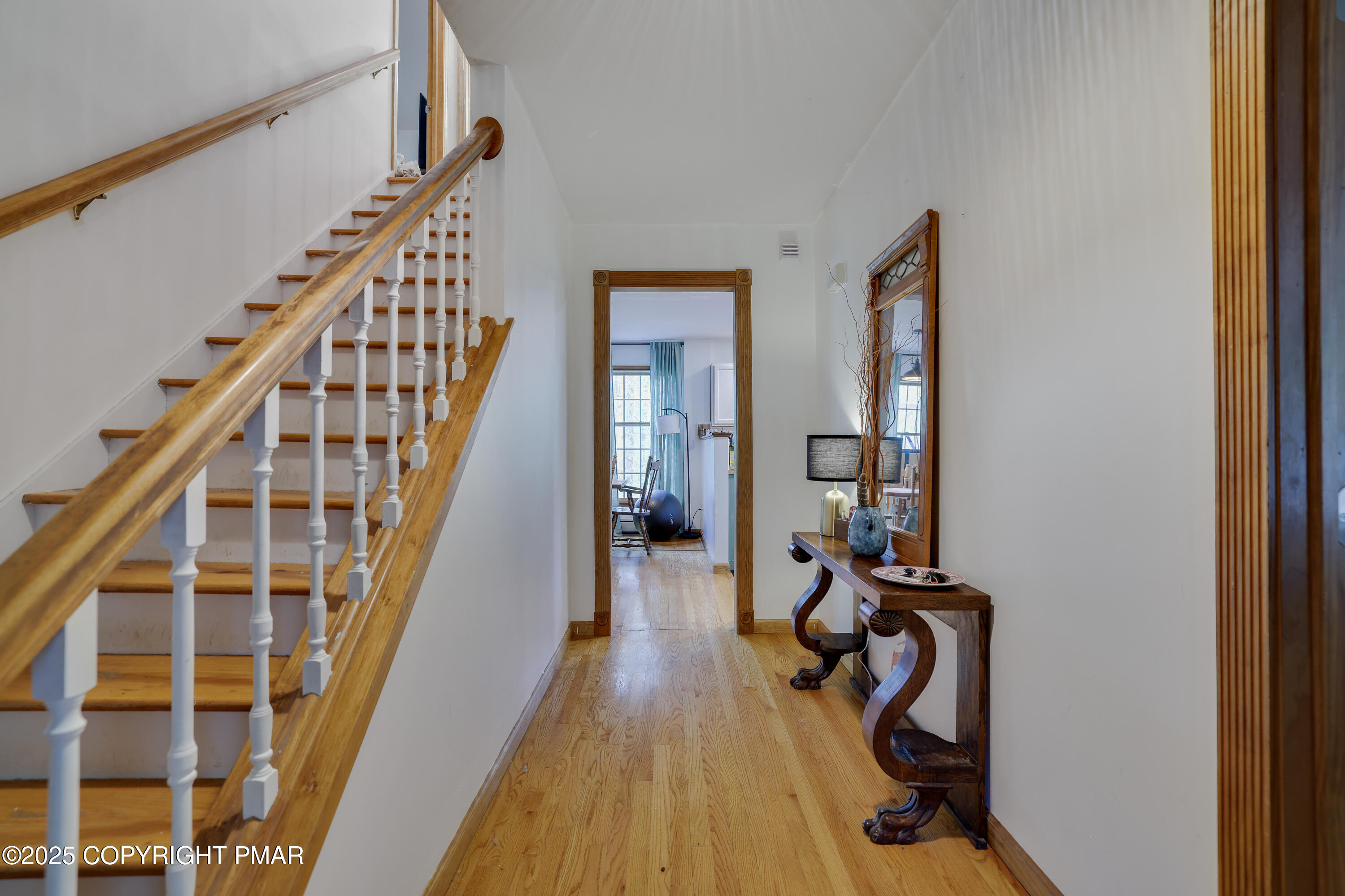 113 Hemlock Road Tannersville, PA 18372 - Photo 7 of 68 a view of a hallway with wooden floor and staircase