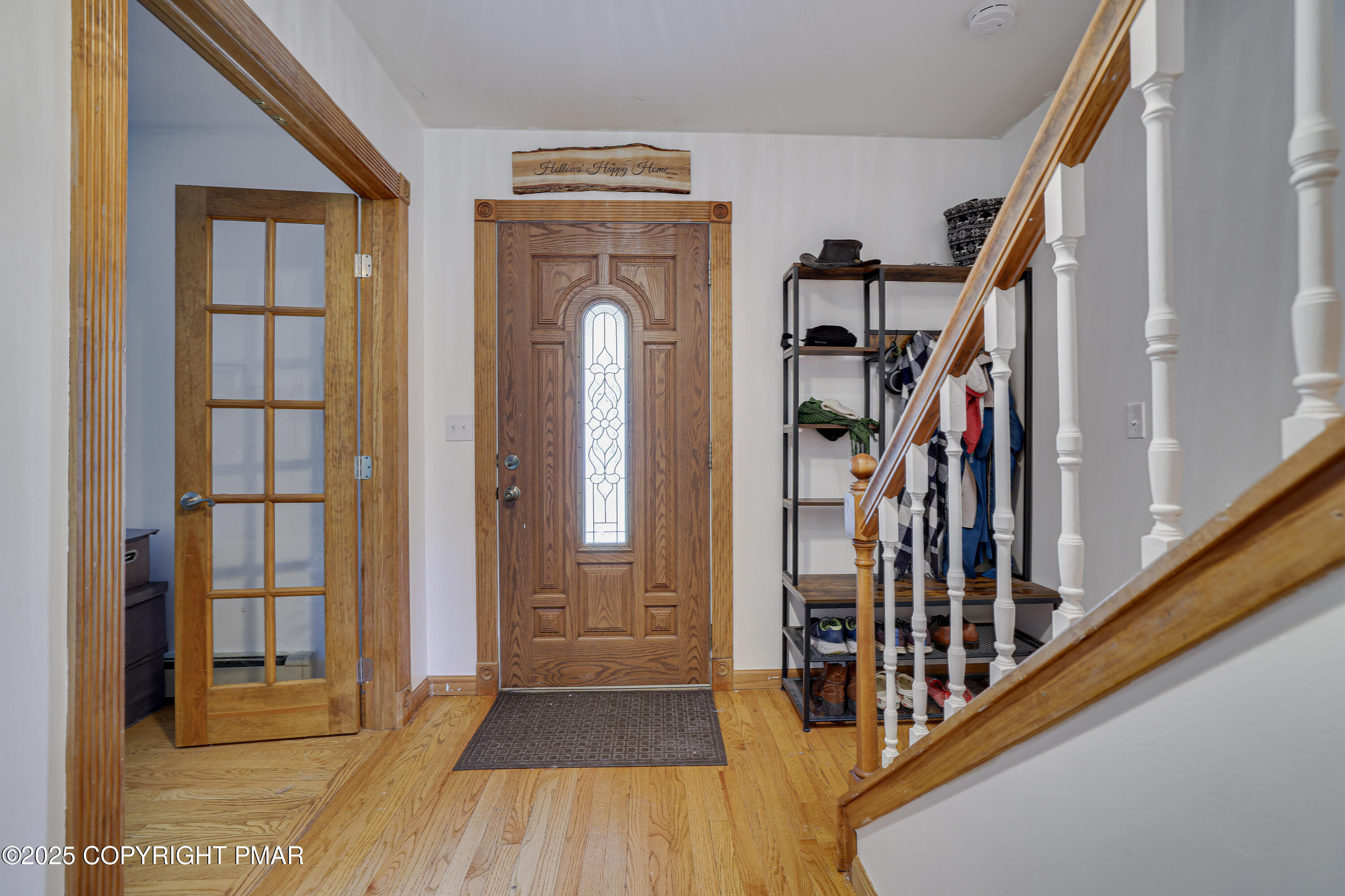 113 Hemlock Road Tannersville, PA 18372 - Photo 8 of 68 a view of front door with wooden floor and stairs