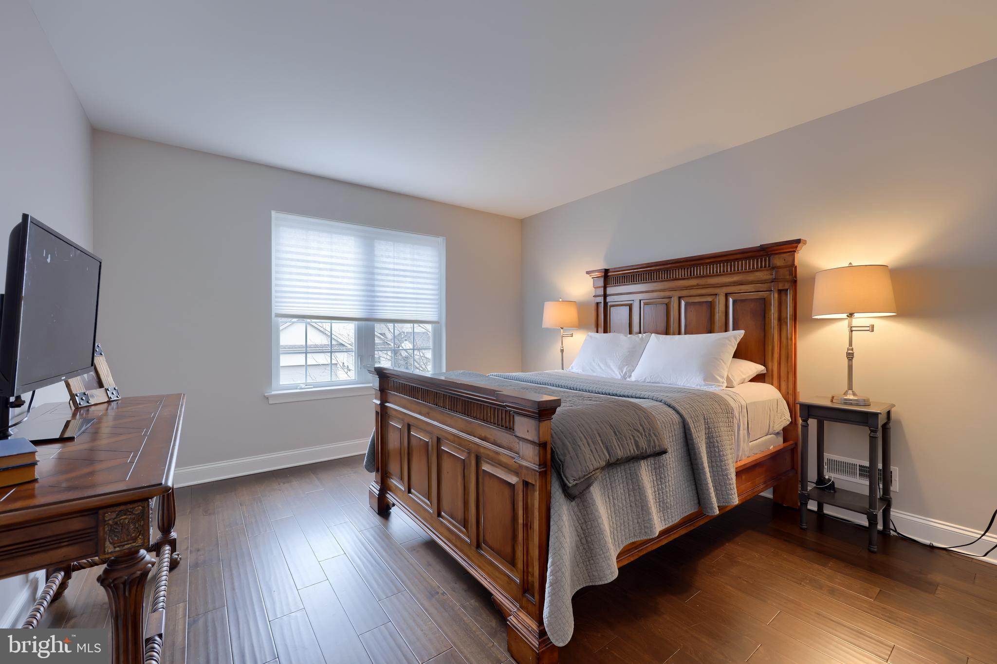 1081 Stillwood Circle Lititz, PA 17543 - Photo 21 of 36 a bed sitting in a bedroom next to a window