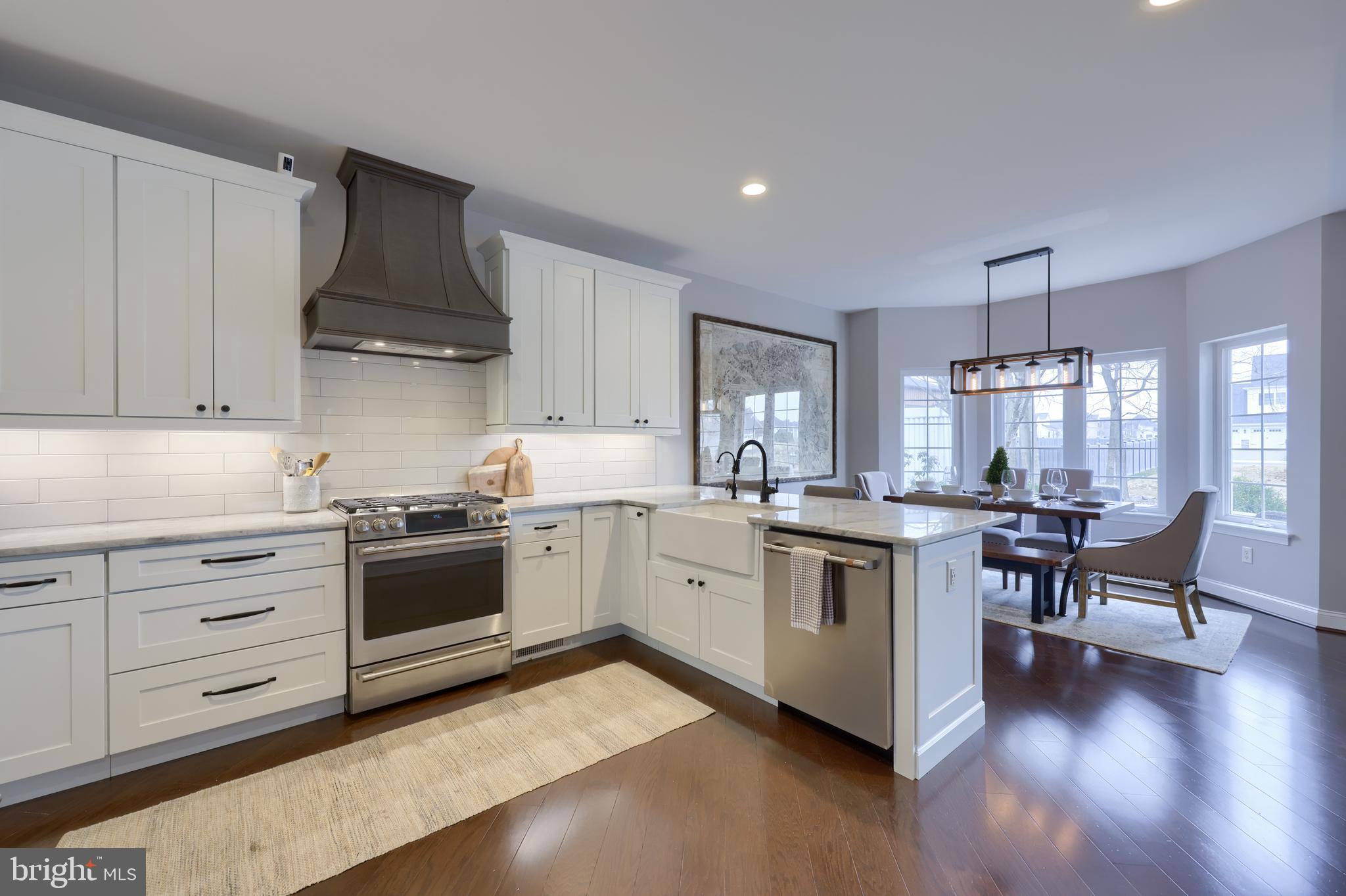 1081 Stillwood Circle Lititz, PA 17543 - Photo 4 of 36 a kitchen with granite countertop white cabinets and white appliances