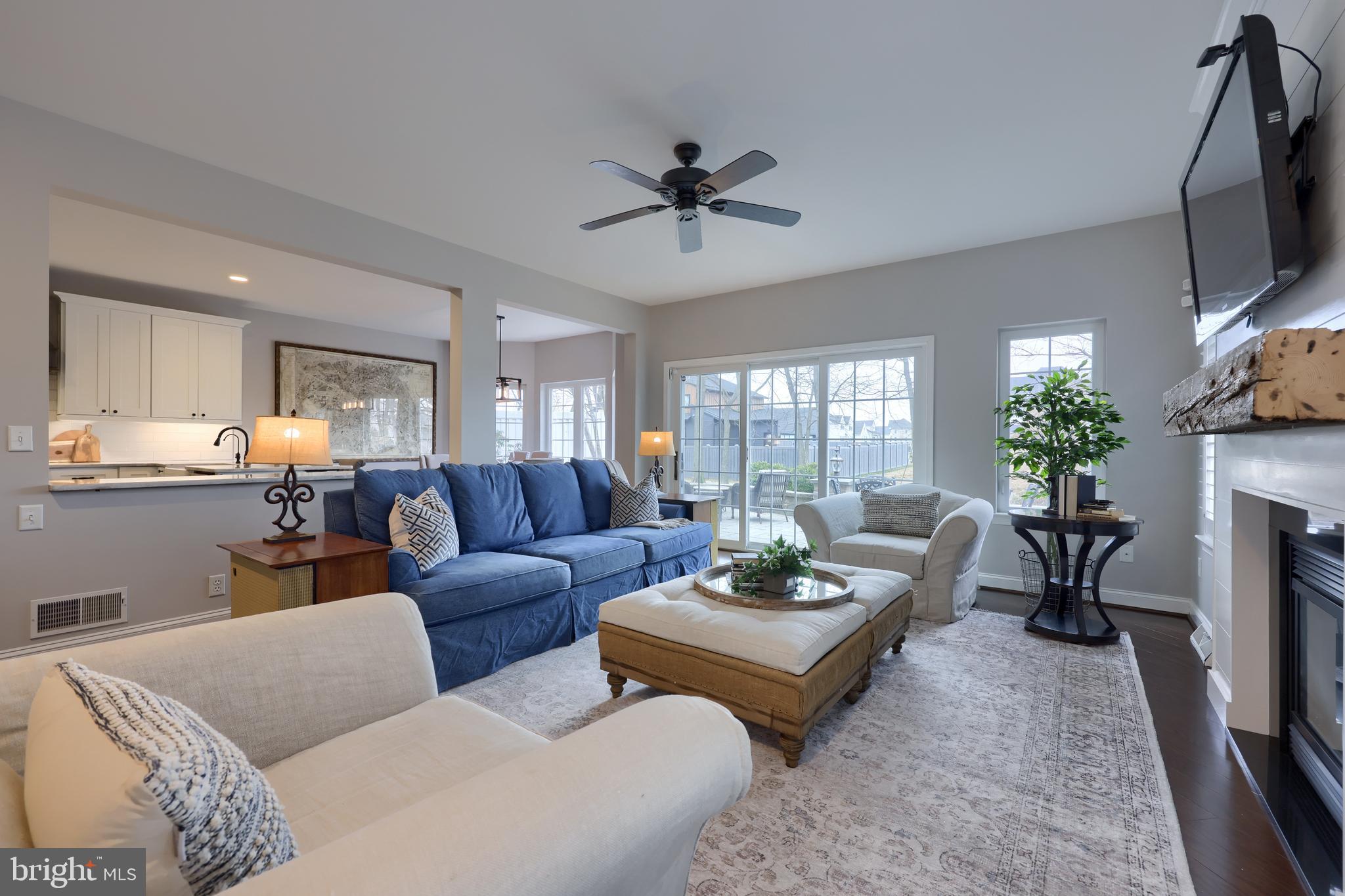1081 Stillwood Circle Lititz, PA 17543 - Photo 6 of 36 a living room with furniture potted plant and a flat screen tv