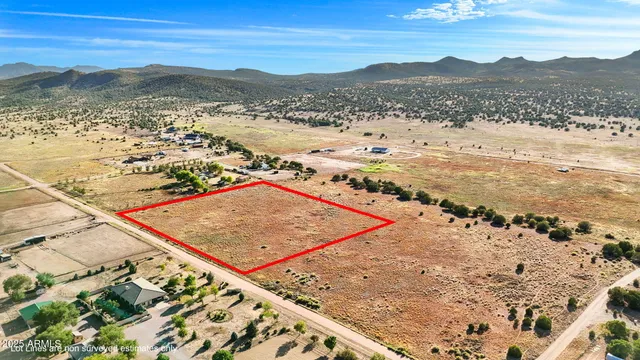 a view of an ocean beach and mountain