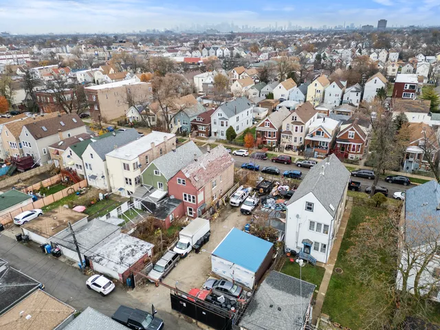 an aerial view of a city with lots of residential buildings