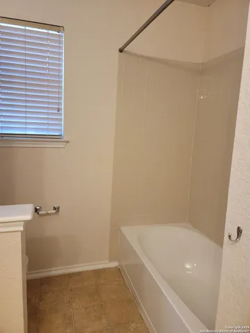 a bathroom with a bathtub