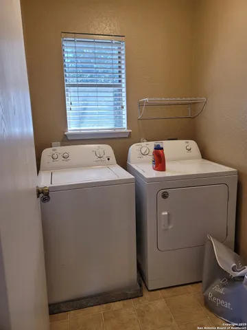 a utility room with dryer and washer