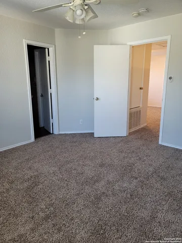 an empty room with a bathroom