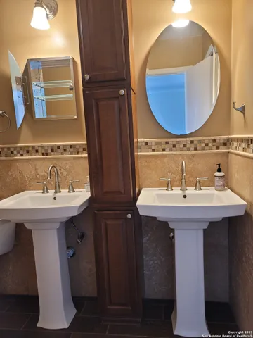 a bathroom with a sink and a mirror