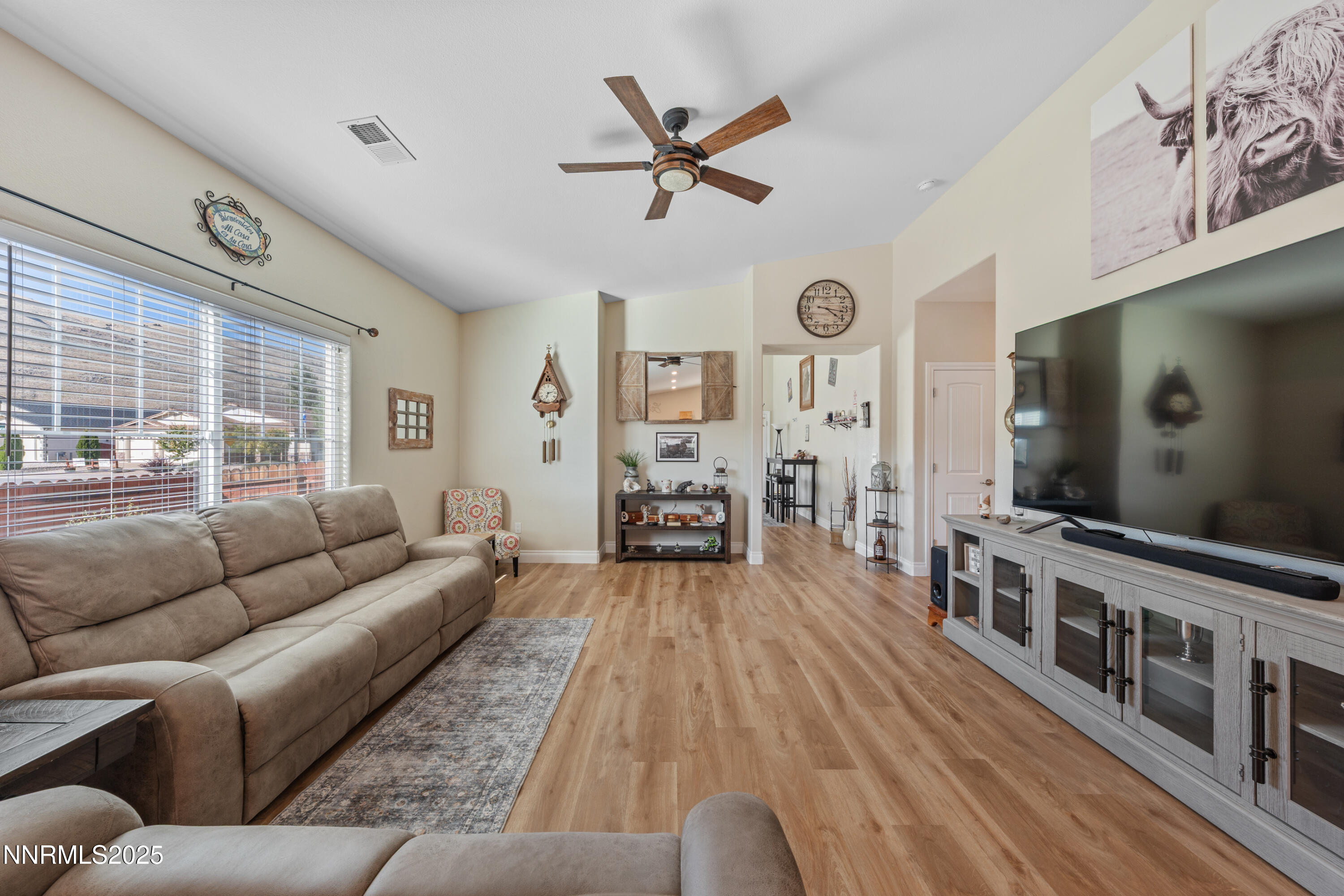 18520 Silverbell Court Reno, NV 89508 - Photo 14 of 60 a living room with furniture and a flat screen tv