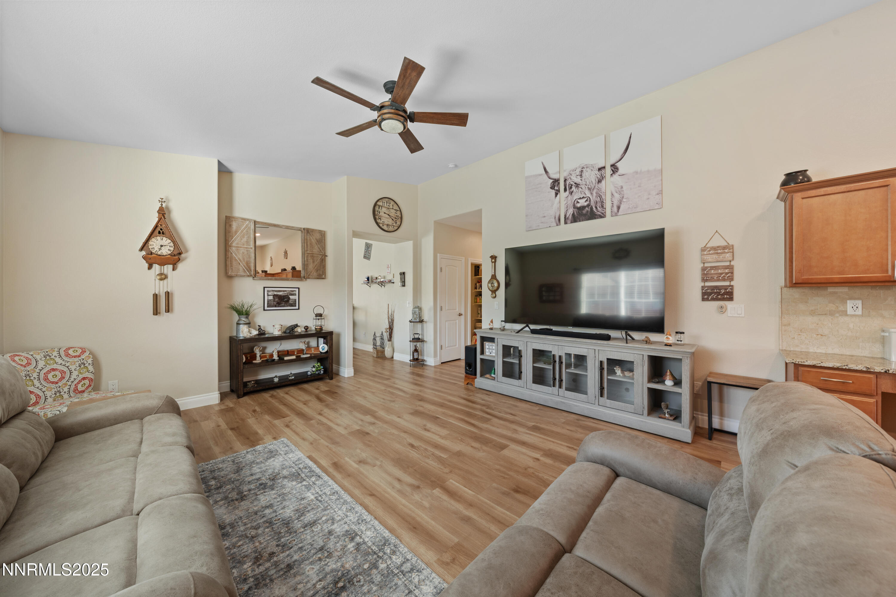 18520 Silverbell Court Reno, NV 89508 - Photo 15 of 60 a living room with furniture and a flat screen tv