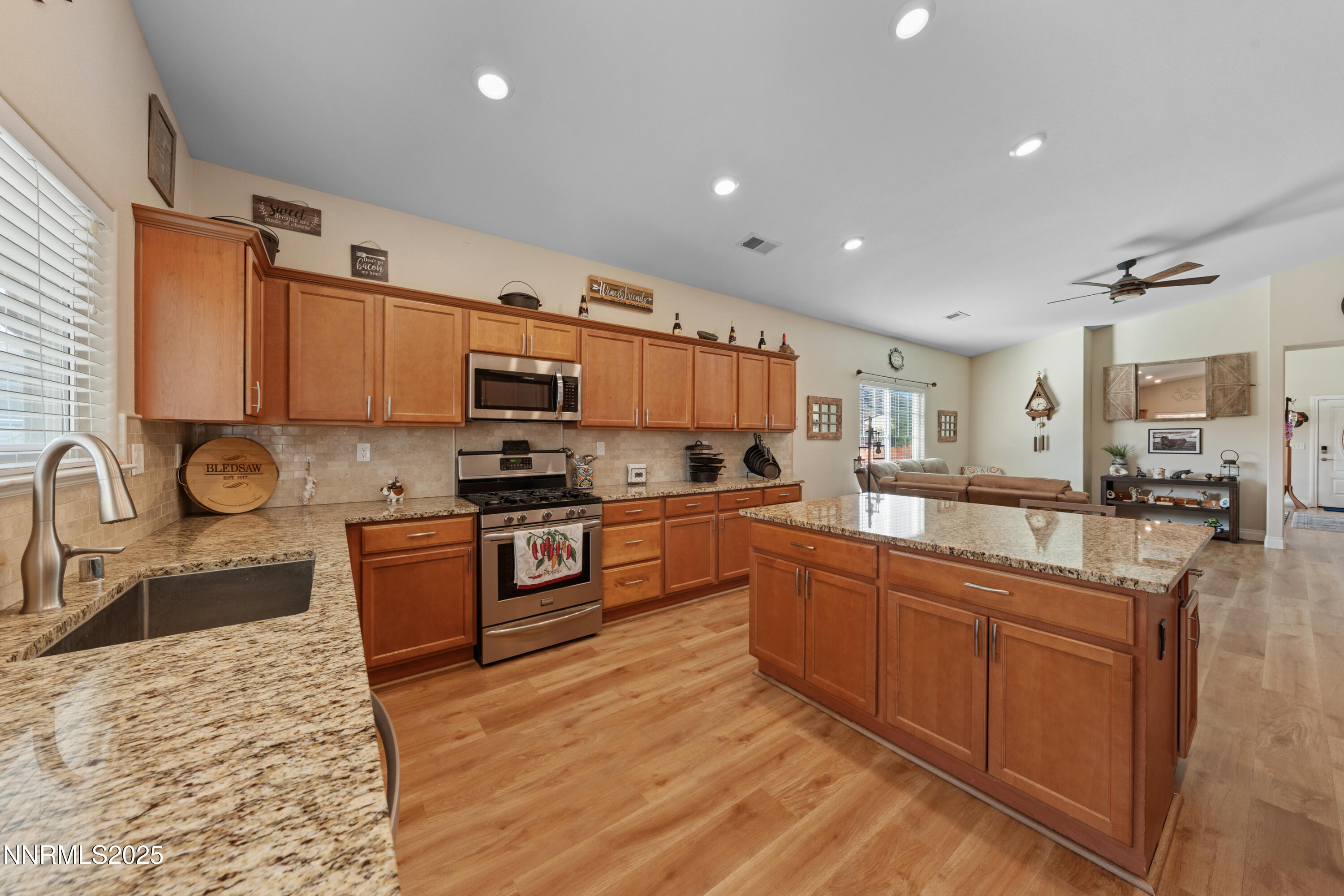 18520 Silverbell Court Reno, NV 89508 - Photo 20 of 60 a kitchen with stainless steel appliances granite countertop a sink stove and refrigerator