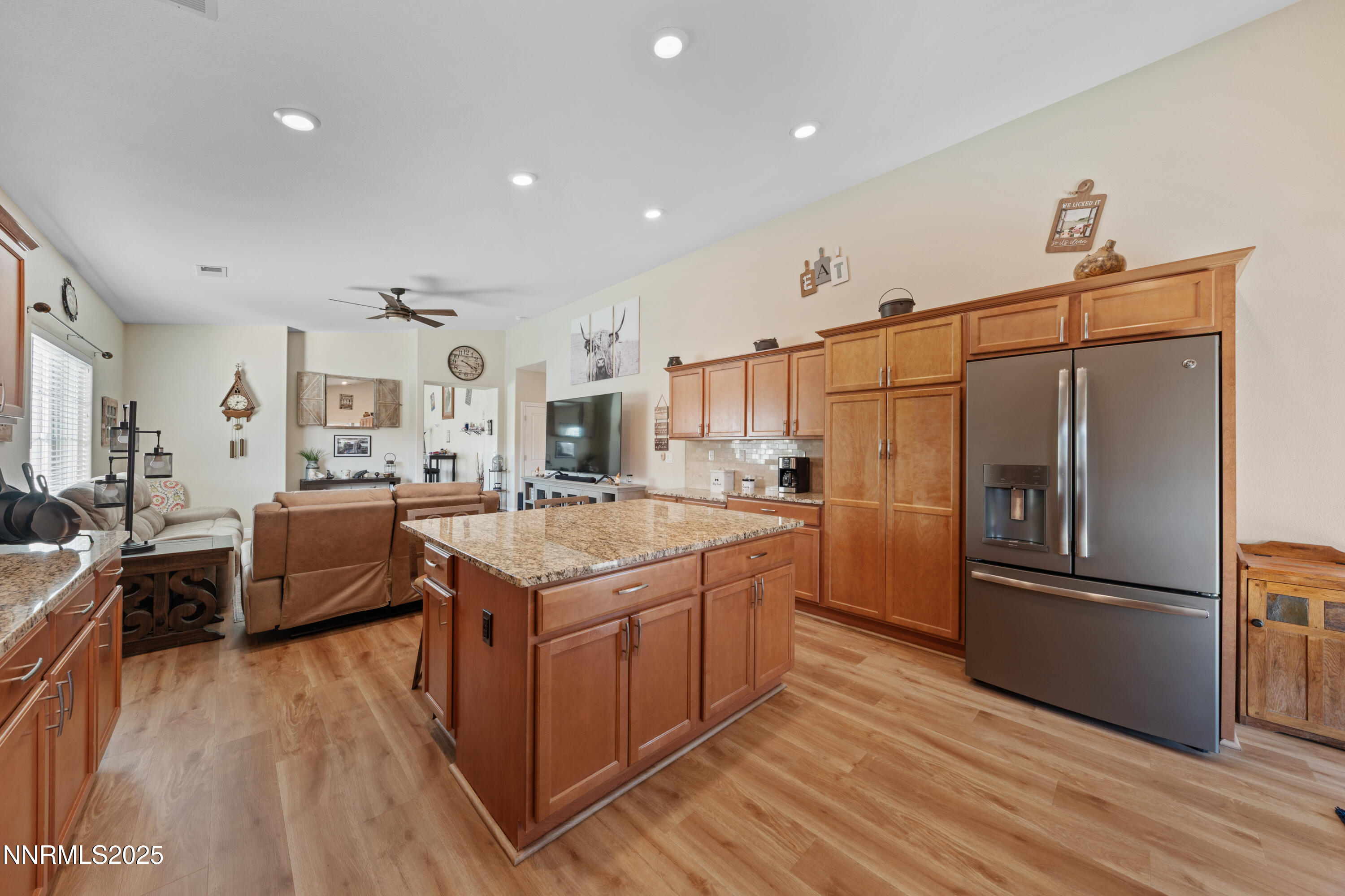 18520 Silverbell Court Reno, NV 89508 - Photo 21 of 60 a kitchen with stainless steel appliances granite countertop a refrigerator a stove and a wooden floors