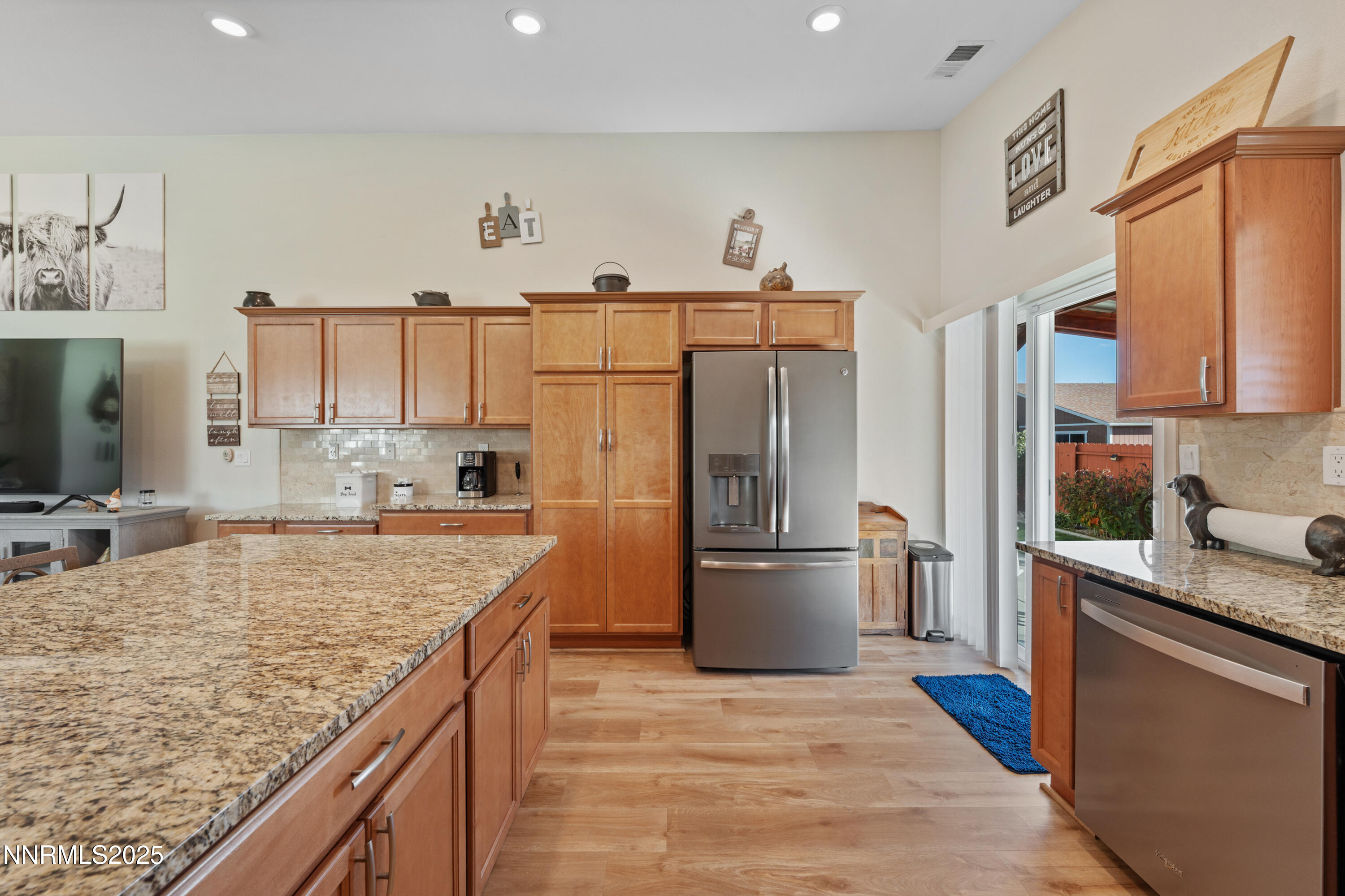 18520 Silverbell Court Reno, NV 89508 - Photo 22 of 60 a kitchen with stainless steel appliances granite countertop a sink stove and refrigerator