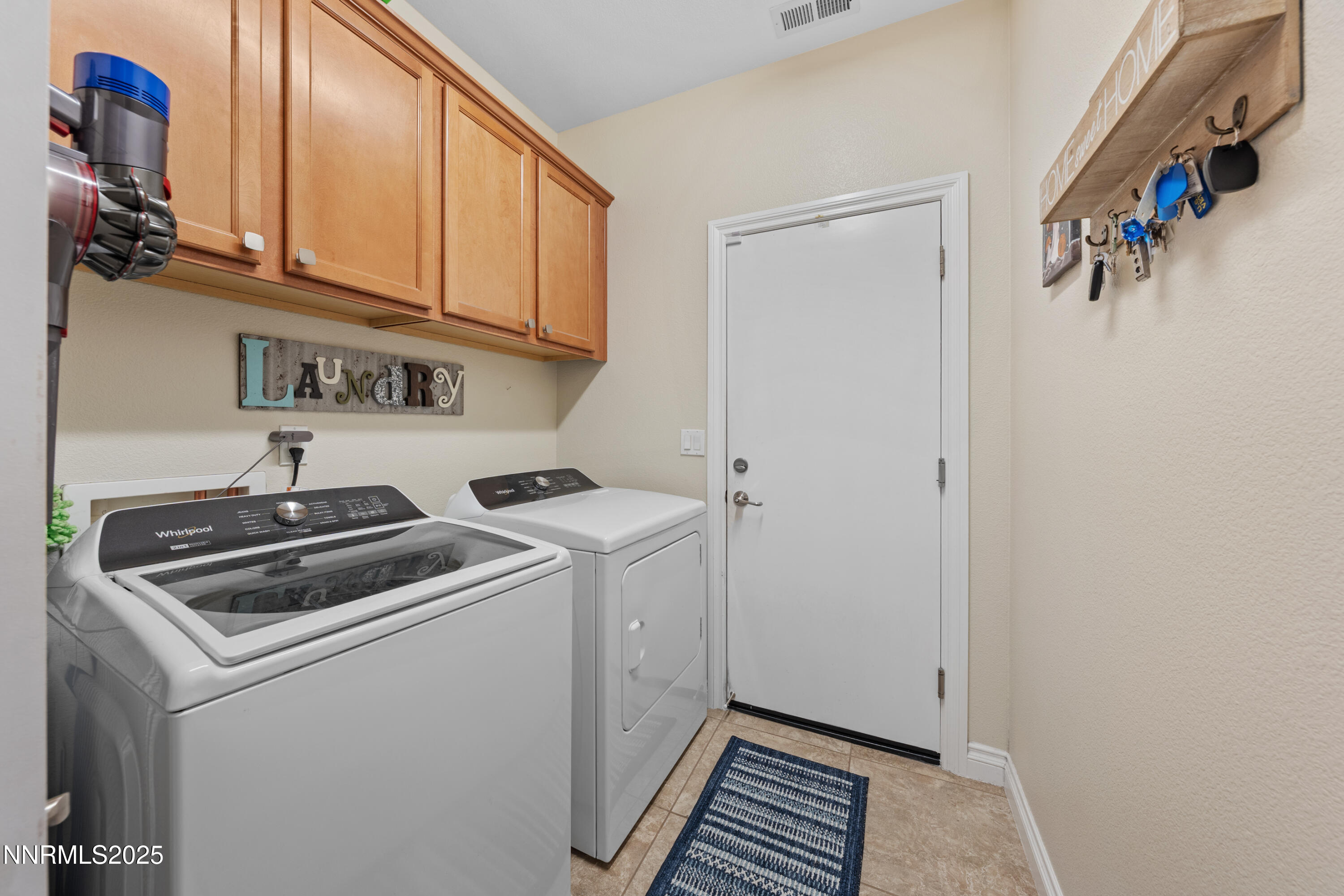 18520 Silverbell Court Reno, NV 89508 - Photo 25 of 60 a view of storage and utility room with washer and dryer