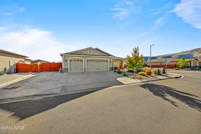 a view of a house with a flower garden