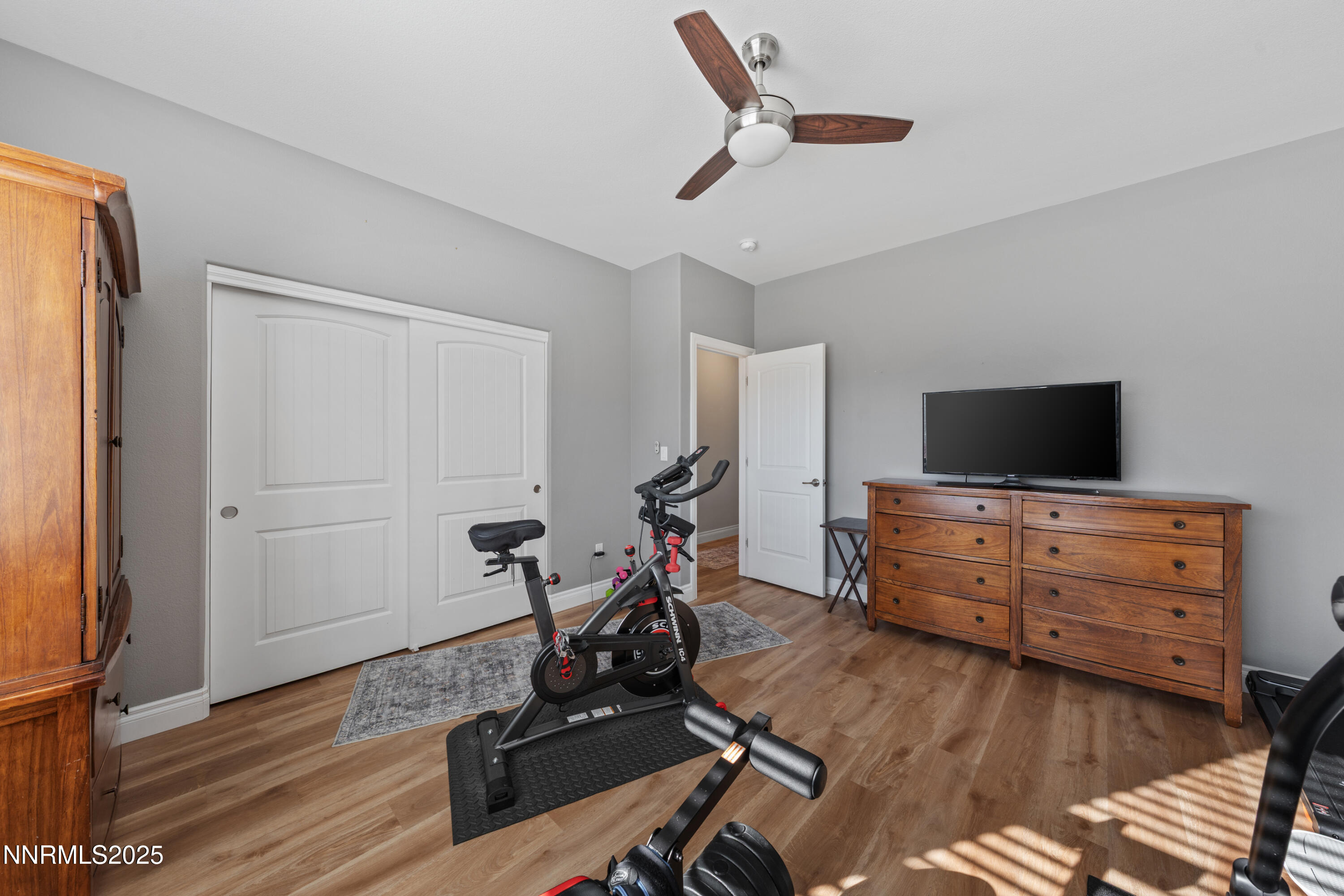 18520 Silverbell Court Reno, NV 89508 - Photo 36 of 60 a view of room with wooden floor and ceiling fan