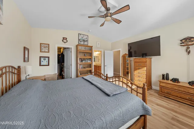 a view of a patio with table and chairs with wooden floor and fence