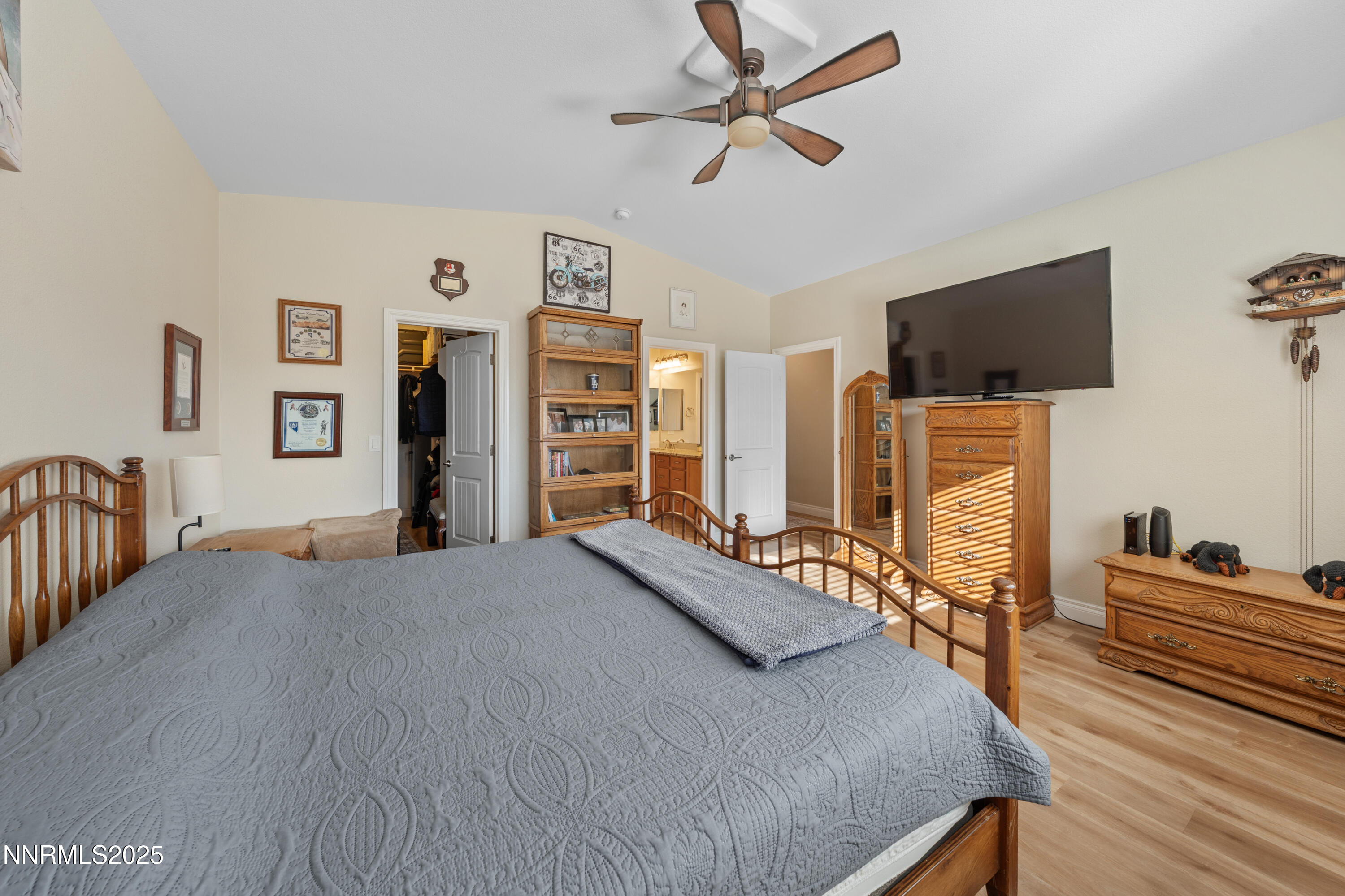 18520 Silverbell Court Reno, NV 89508 - Photo 41 of 60 a bedroom with a bed and a flat screen tv