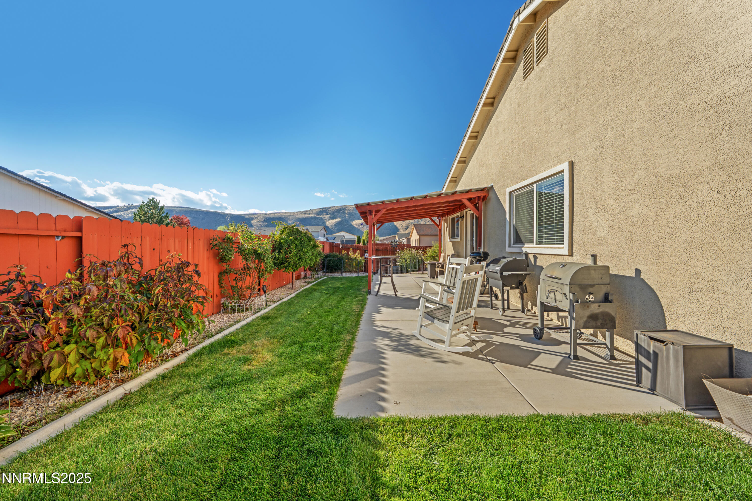 18520 Silverbell Court Reno, NV 89508 - Photo 48 of 60 a view of a patio with table and chairs with wooden floor and fence