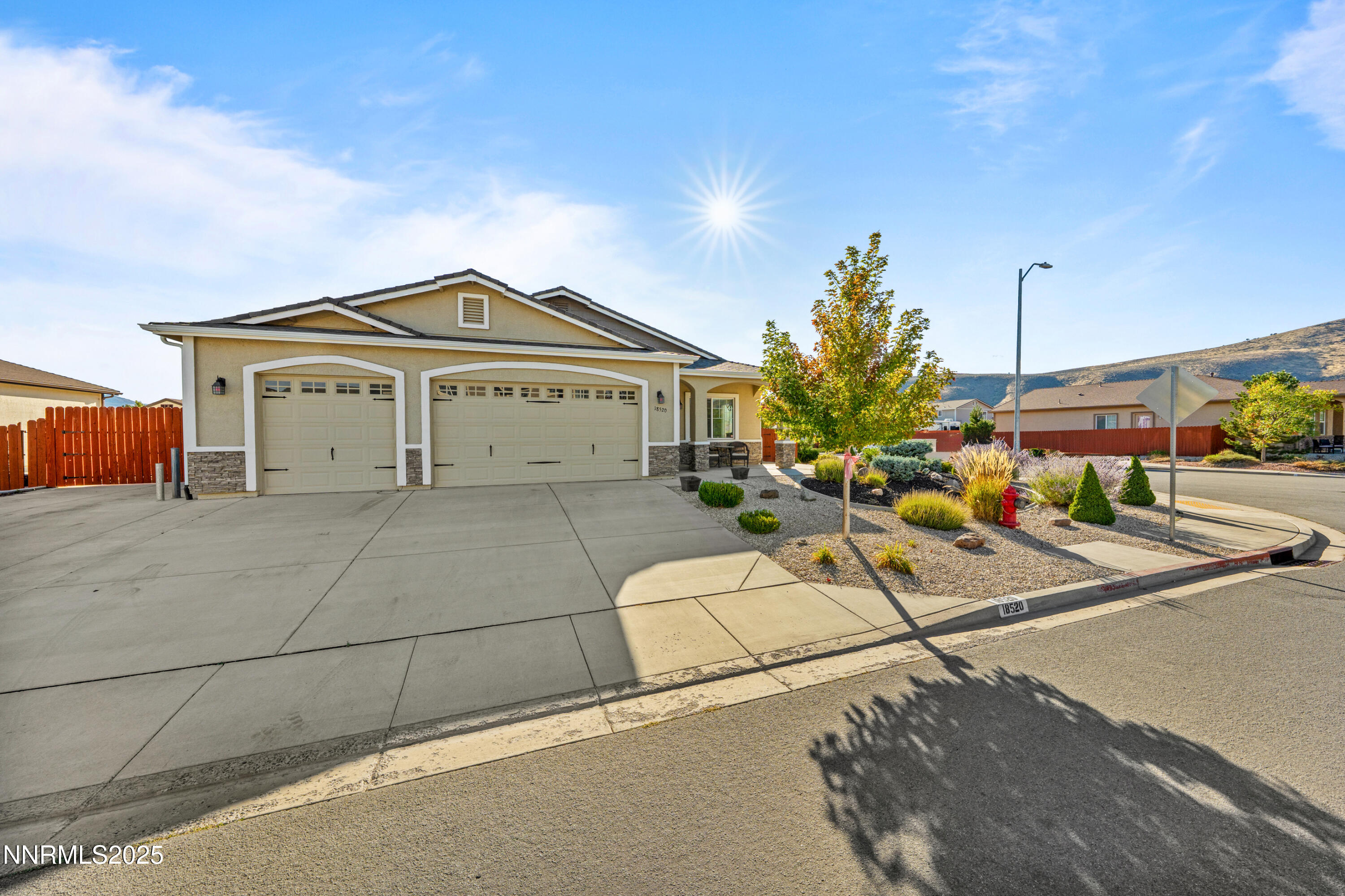 18520 Silverbell Court Reno, NV 89508 - Photo 5 of 60 a view of a house with a flower garden