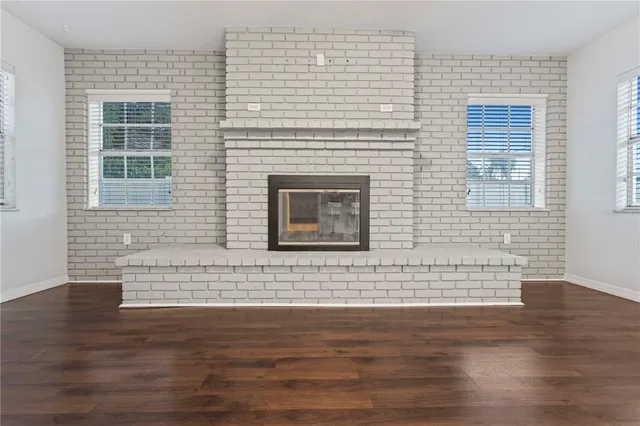 a view of wooden floor and a fireplace