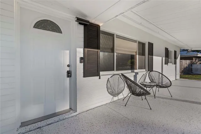 a bathroom with a granite countertop sink a mirror and a shower