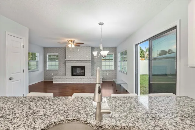 a view of a living room and a fireplace
