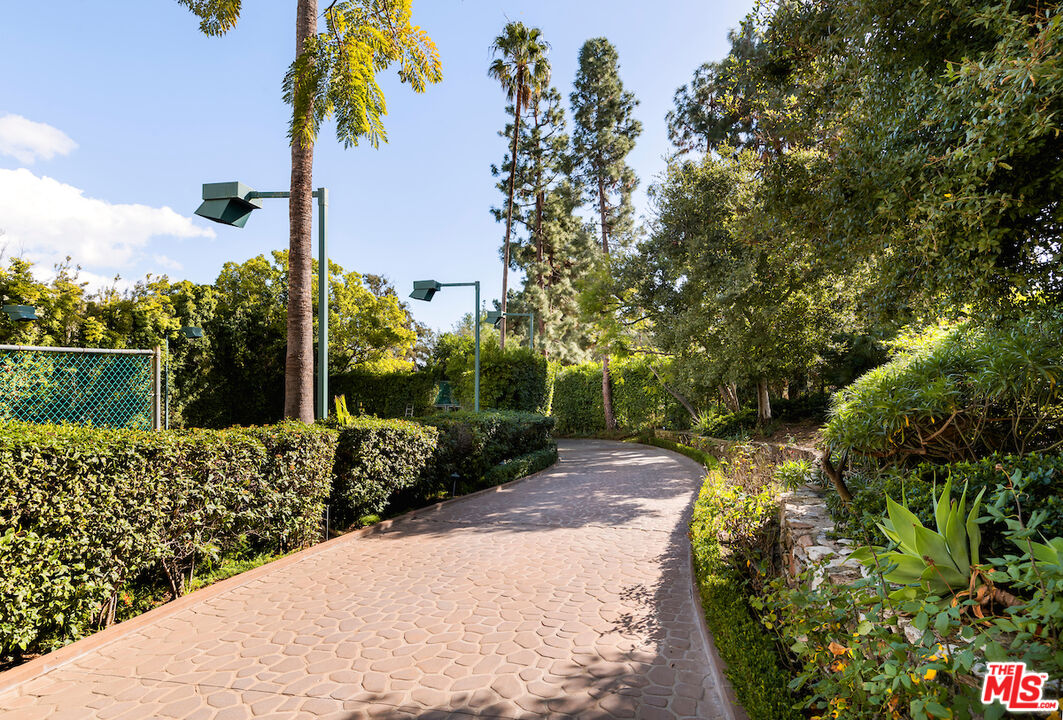 804 Walden Drive Beverly Hills, CA 90210 - Photo 5 of 12 a view of a park with plants and a bench