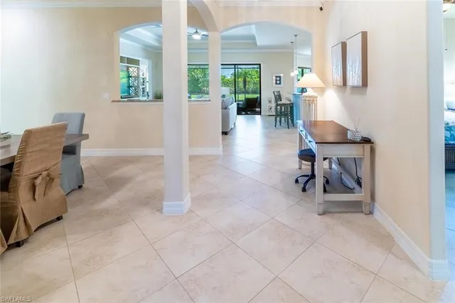 a view of a livingroom with workspace and a window
