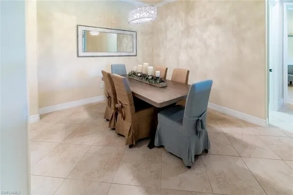 a dining room with furniture and a window