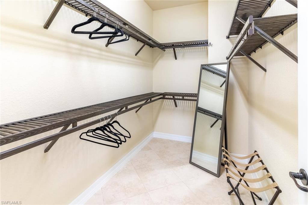 9372 Vercelli Court Naples, FL 34113 - Photo 21 of 50 a view of a room with rack on the wall