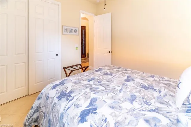 a bedroom with a bed and a cabinets