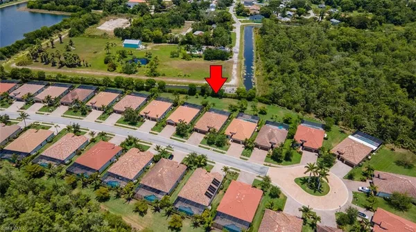an aerial view of a house with an outdoor space