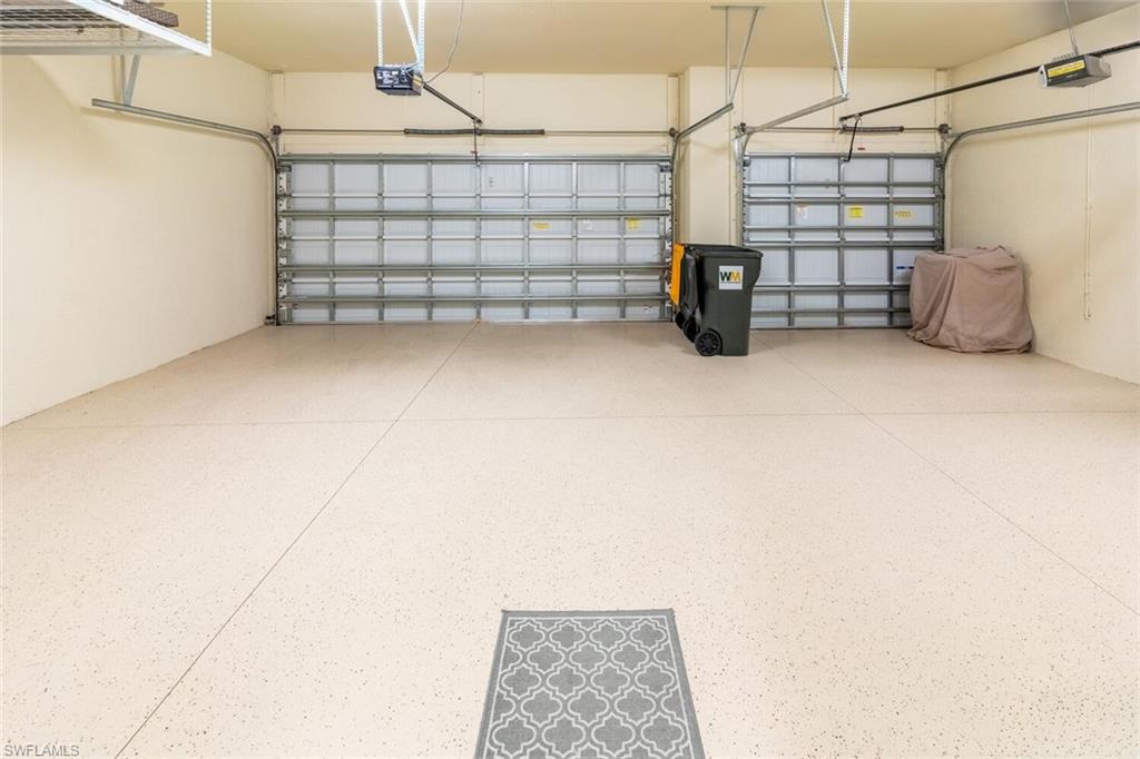 9372 Vercelli Court Naples, FL 34113 - Photo 33 of 50 a view of a garage