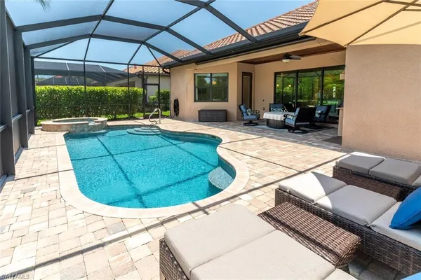 a view of a swimming pool with a patio