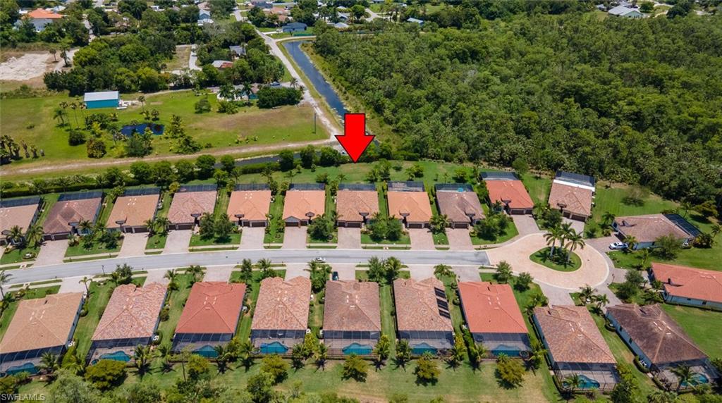 9372 Vercelli Court Naples, FL 34113 - Photo 40 of 50 a view of swimming pool with a yard and plants