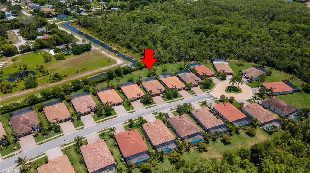 9372 Vercelli Court Naples, FL 34113 - Photo 41 of 50 an aerial view of swimming pool and outdoor space